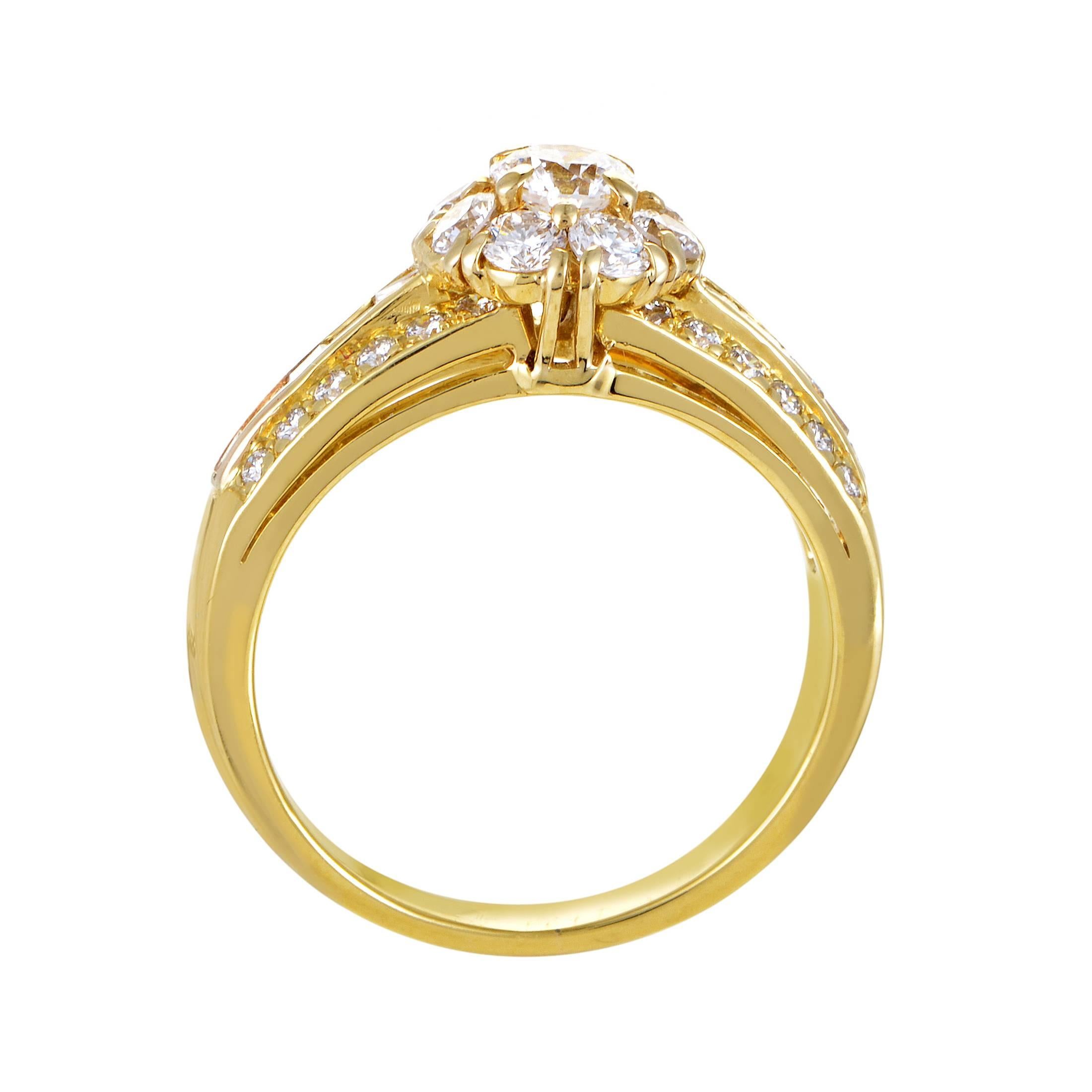This lovely ring from Van Cleef & Arpels features a classic design that is perfect for any lady. The ring is made of 18K yellow gold and features shanks set with diamonds. as well as a floral-shaped motif comprised of diamonds topping off the