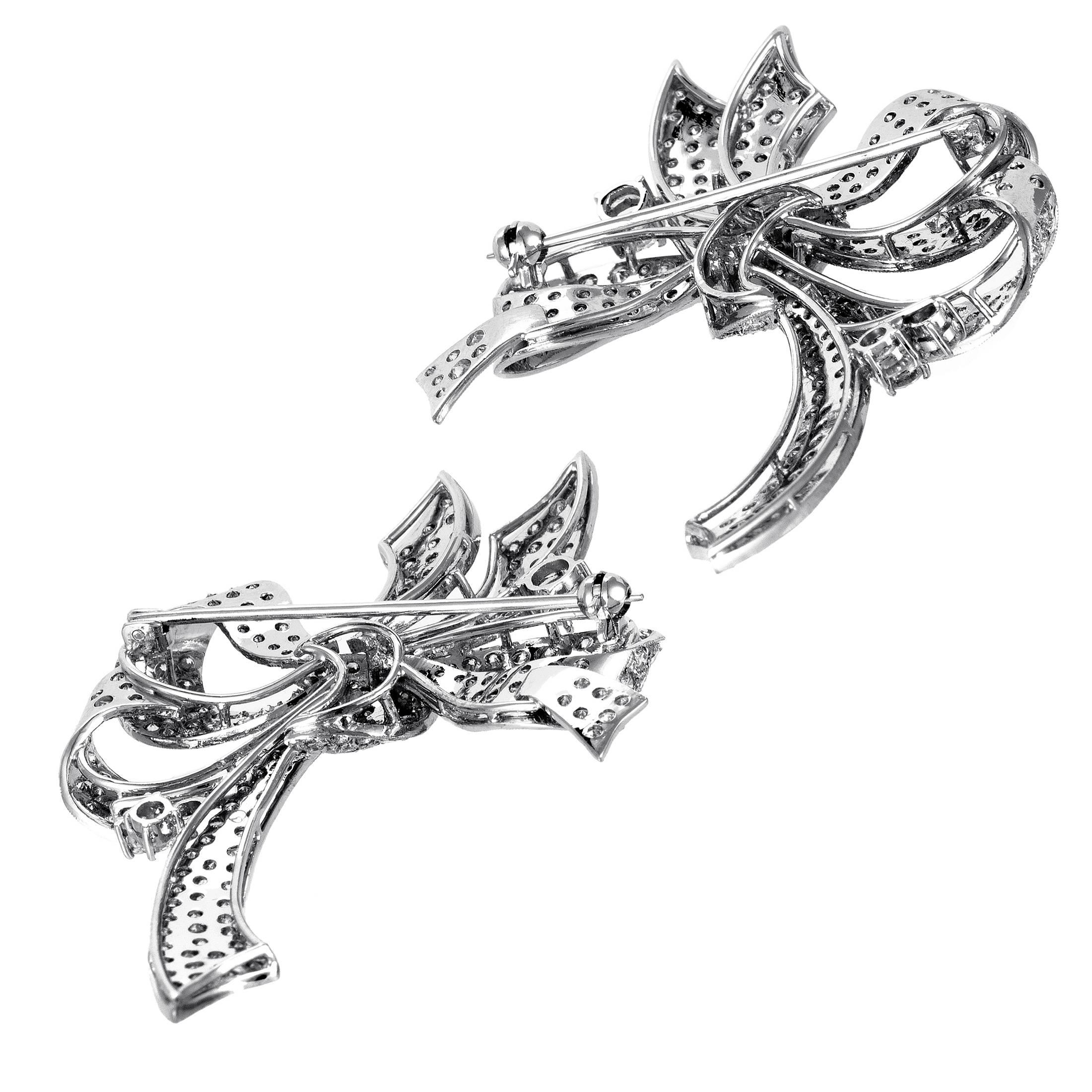 Designed in the adorable and graceful form of bows, this astonishing brooch set is crafted expertly from prestigious 18K white gold and given a scintillating sparkle by the alluring diamonds weighing in total 9.50 carats.