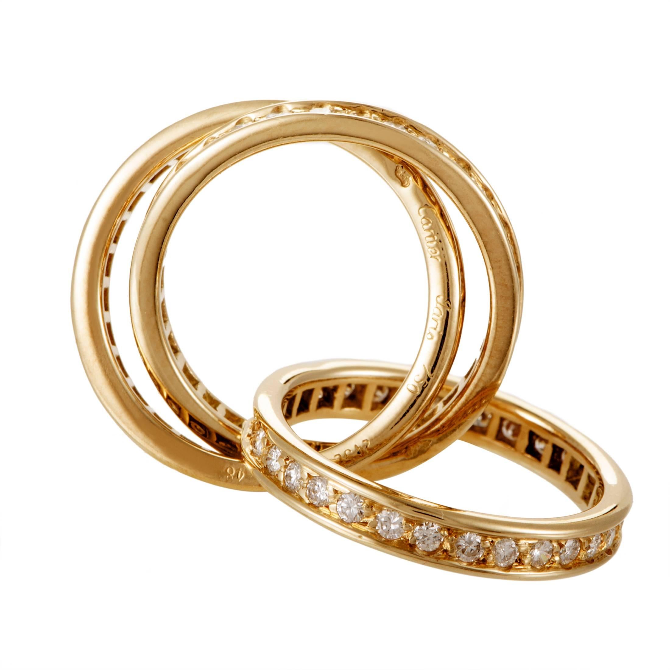 Inspired by their famous Trinity design and crafted expertly from prestigious 18K yellow gold, this outstanding ring from Cartier is comprised of three nifty bands embellished tastefully with lustrous diamonds weighing in total 1.50 carats.
Retail