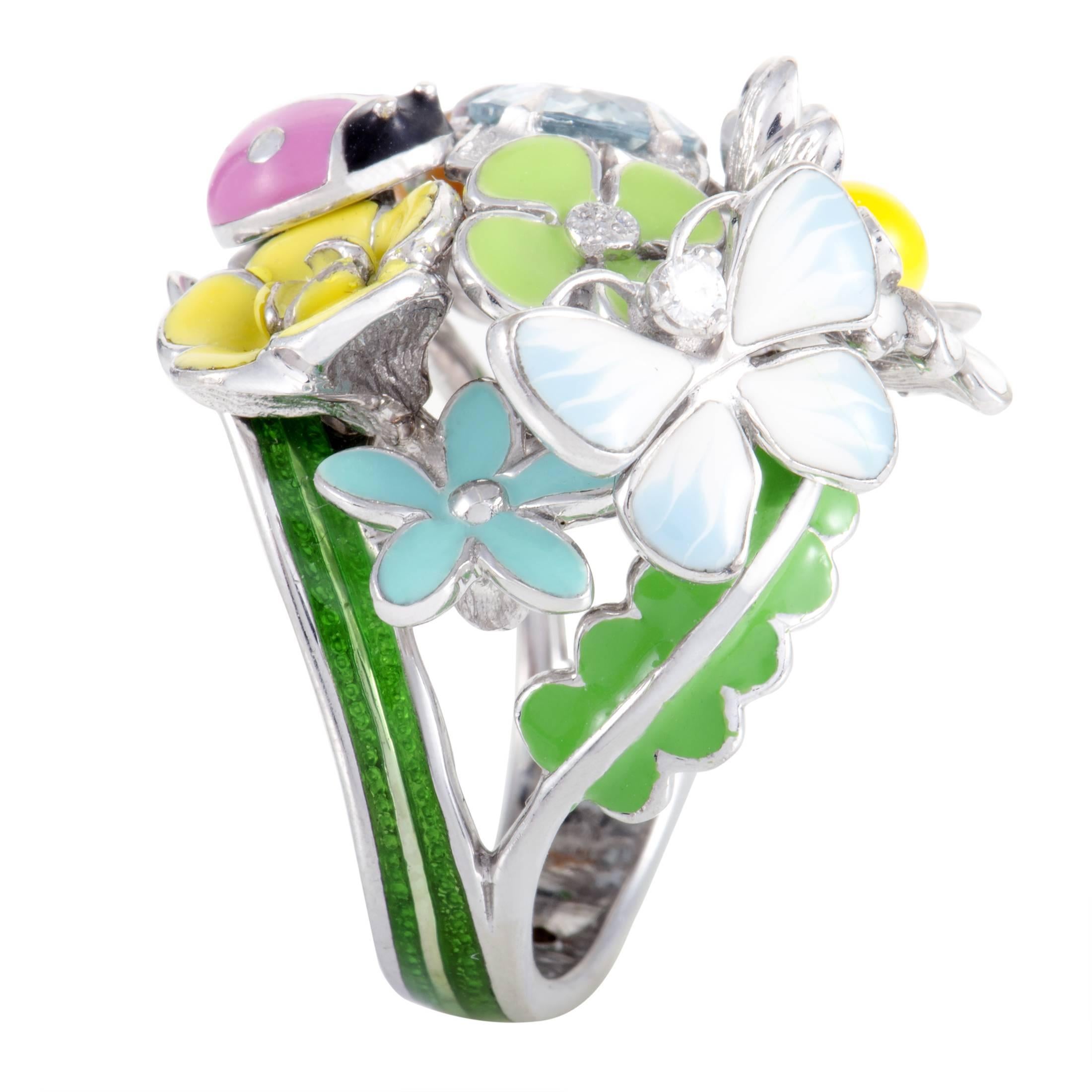 Vivacious, colorful and stylish, this marvelous ring from Dior is made of splendid 18K white gold and embellished with an extraordinary arrangement of diverse enameled decorations along with bright aquamarine glisten and 0.04ct of diamond