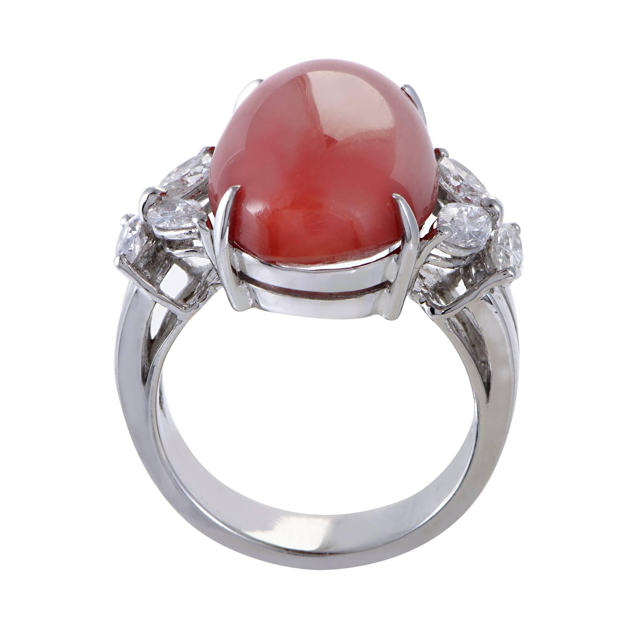 Complemented with lustrous diamonds weighing in total 1.00 carat which also perfectly match the prestigious gleam of the platinum body, the astonishing coral stone creates a fantastic sight with its passionate color and smooth shape in this