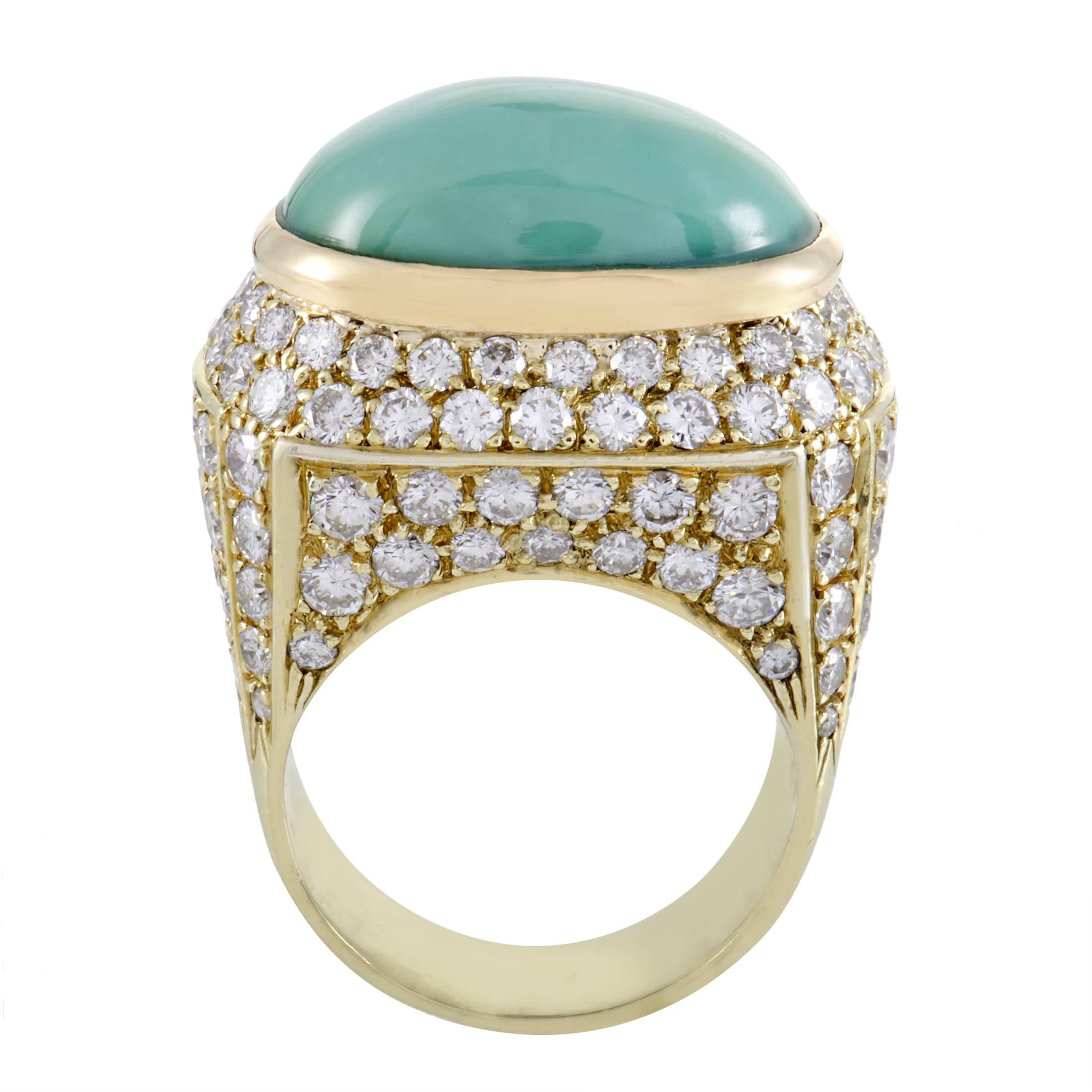 Lending its pleasant color and immaculate gleam to this majestic ring to produce exceptional aesthetic balance, the wonderful turquoise stone tastefully contrasts the glamorous blend of 18K yellow gold and glittering diamonds weighing in total