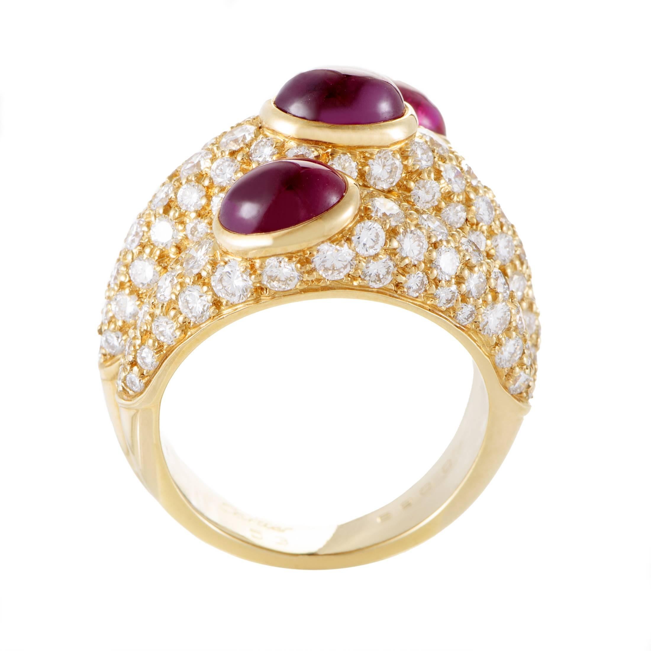 Exuding their passionate allure against a glamorous backdrop of 18K yellow gold and approximately 4.25 carats of glittering diamonds, the charming rubies weighing in total 4.00 carats perfectly complete the exuberant design of this exceptional ring