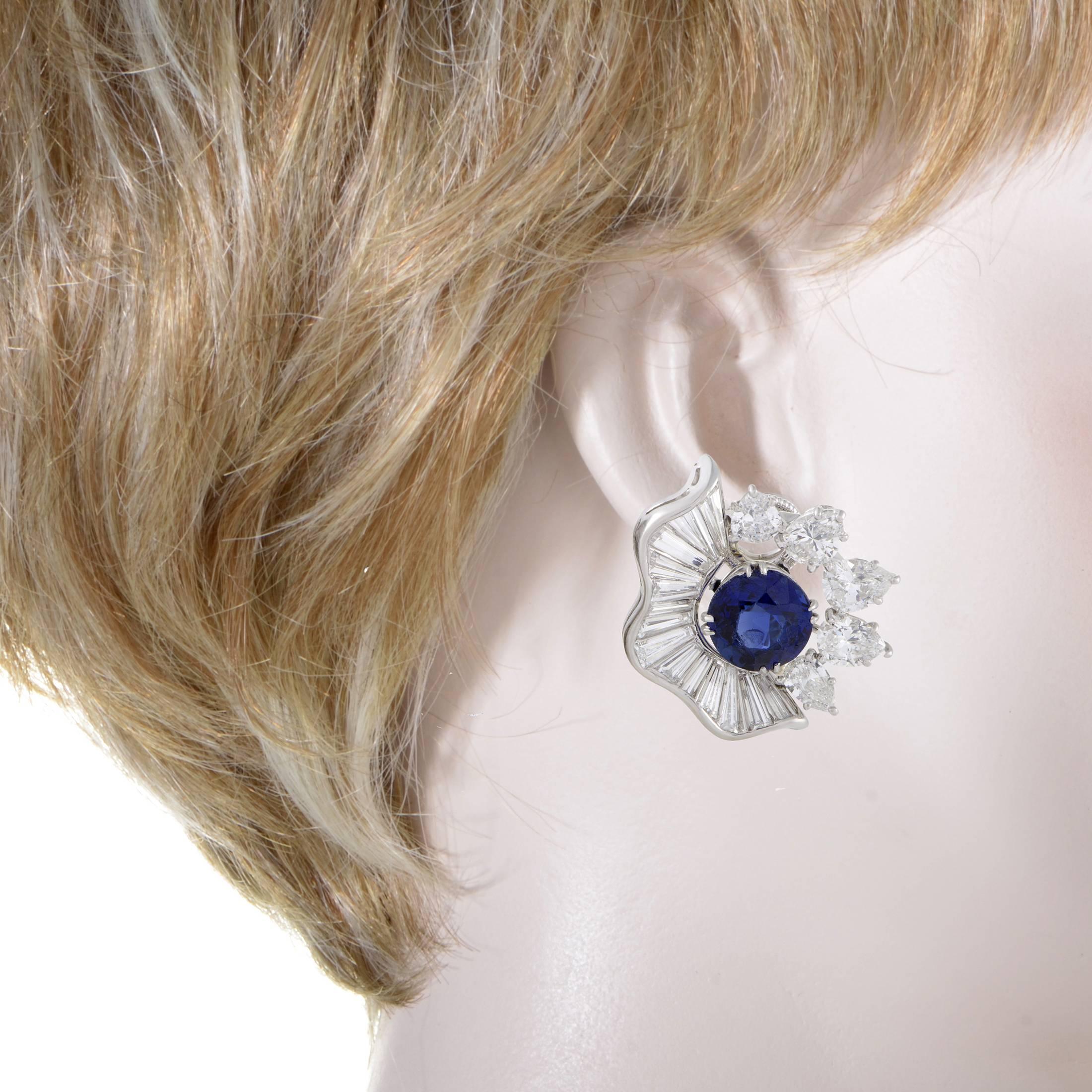 Diversely cut to perfectly fall into a wonderful shape around the regal sapphires totaling approximately 4.00 carats, the glistening diamonds weighing in total approximately 5.50 carats lend their everlasting brilliance to these astonishing platinum