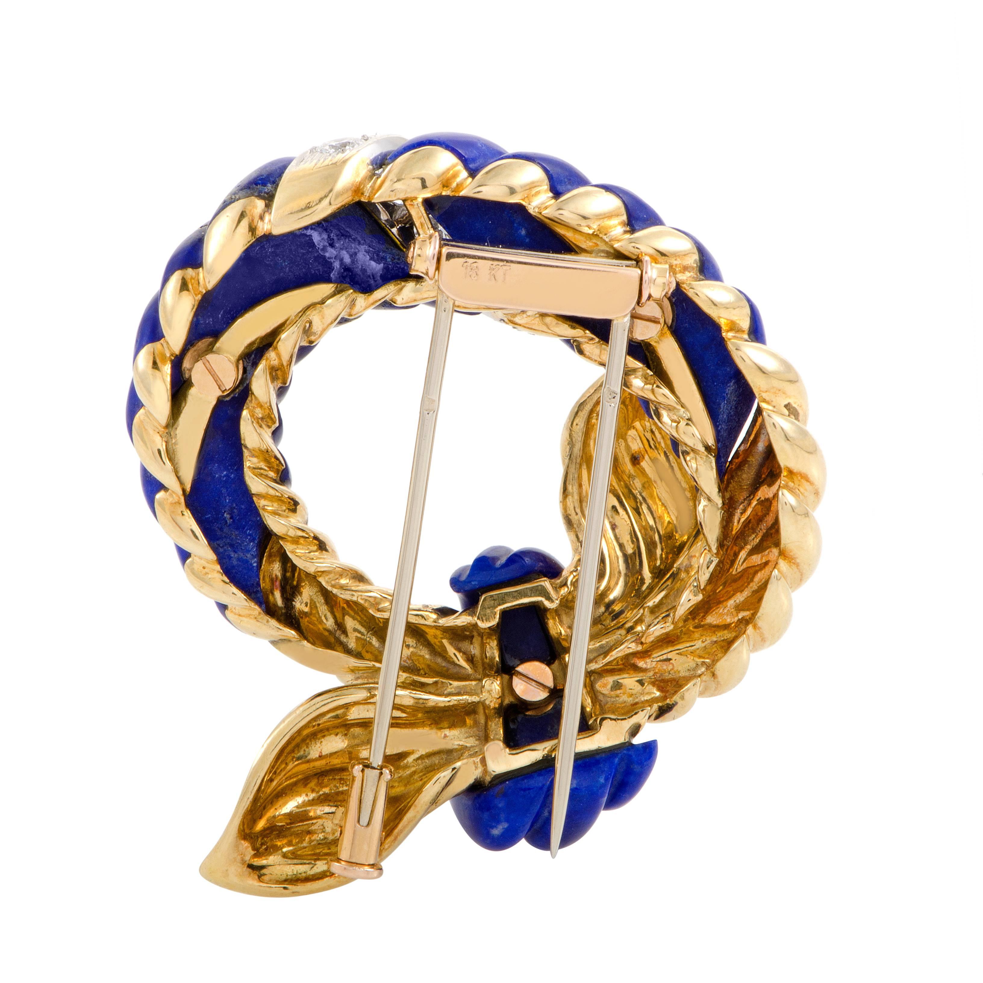 Perfectly in keeping with the alluring shape of the marvelous lapis lazuli, the enchanting 18K yellow gold provides exceptional visual balance in this magnificent brooch from Ilias Lalaounis which also boasts 18K white gold set with 0.45ct of