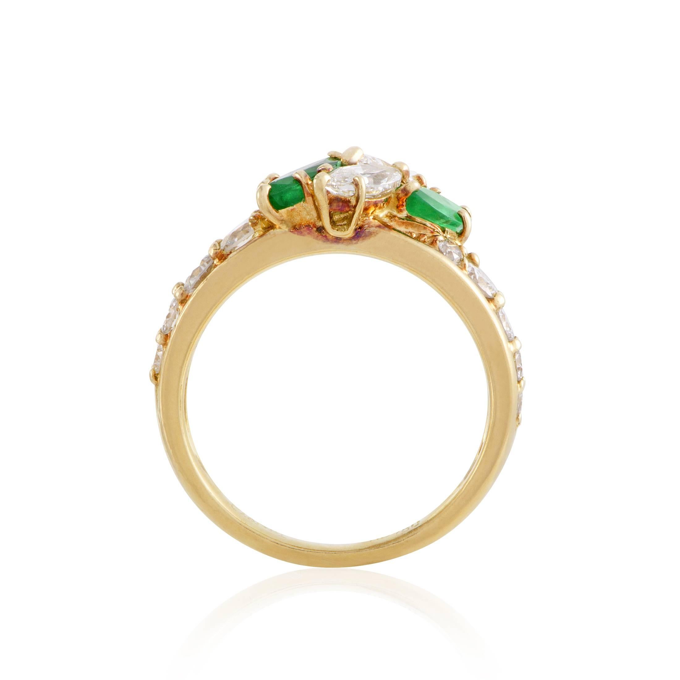 Providing exceptional contrast against the warm nuance of 18K yellow gold and adding appealing color to the lustrous arrangement of diamonds totaling approximately 1.75 carats, the nifty emeralds weigh in total 0.75ct in this remarkable ring from
