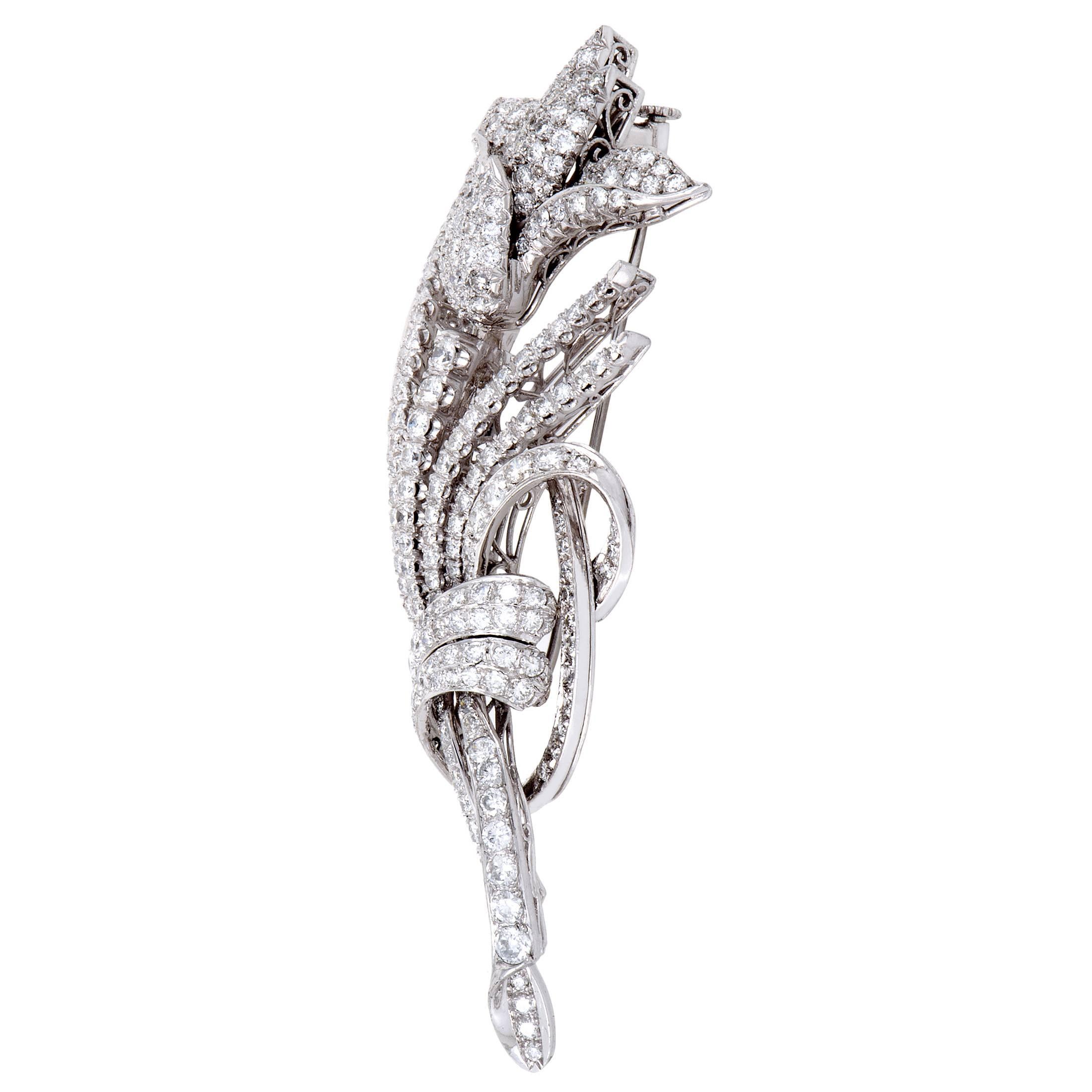 Embellished with exquisitely set and fascinatingly arranged diamonds amounting approximately to 7.50 carats, this extraordinary brooch made of gleaming 18K white gold offers a look of dazzling luxury and produces an eye-catching effect.