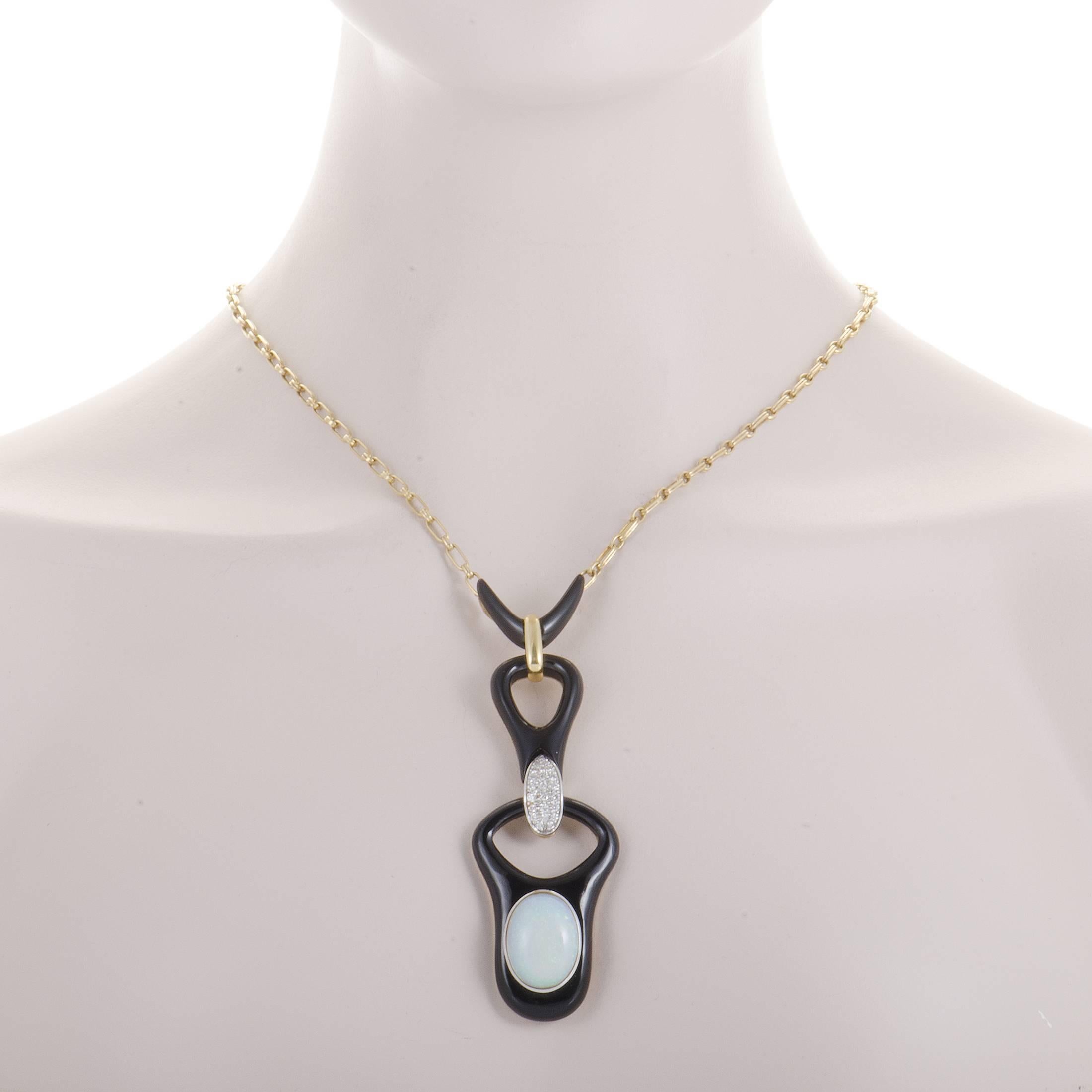 Intriguing décor is comprised of stunningly dark and smooth onyx stones as well as a marvelous opal weighing approximately 12.00 carats in this remarkable necklace which is made of 18K yellow and white gold while also set with 0.60ct of glistening