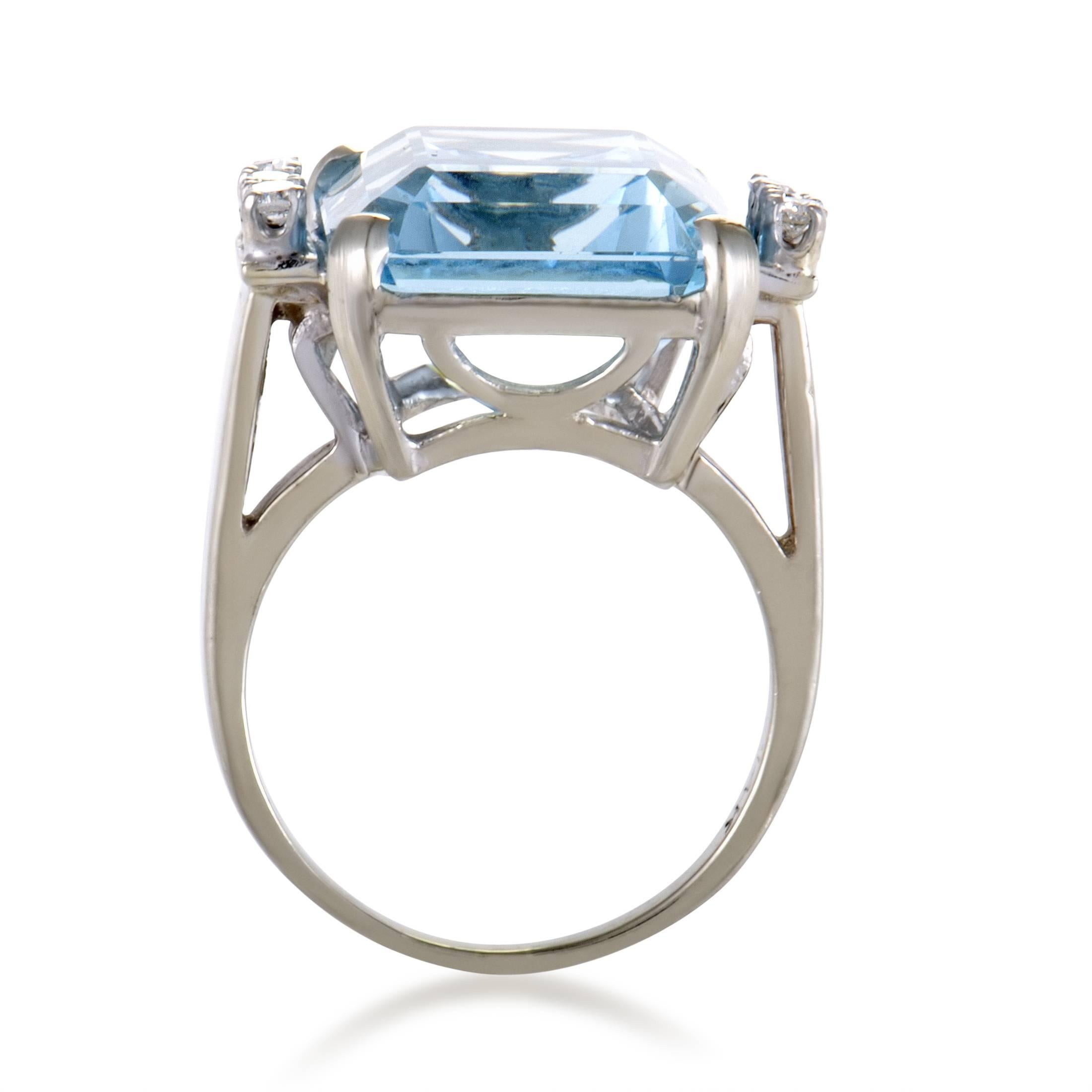 Compelling with its exceptionally pure color, exquisite cut and sheer size, the marvelous aquamarine weighing 19.31 carats is complemented by glistening diamonds totaling approximately 0.30ct in this fantastic 14K white gold ring. 
 Ring Top