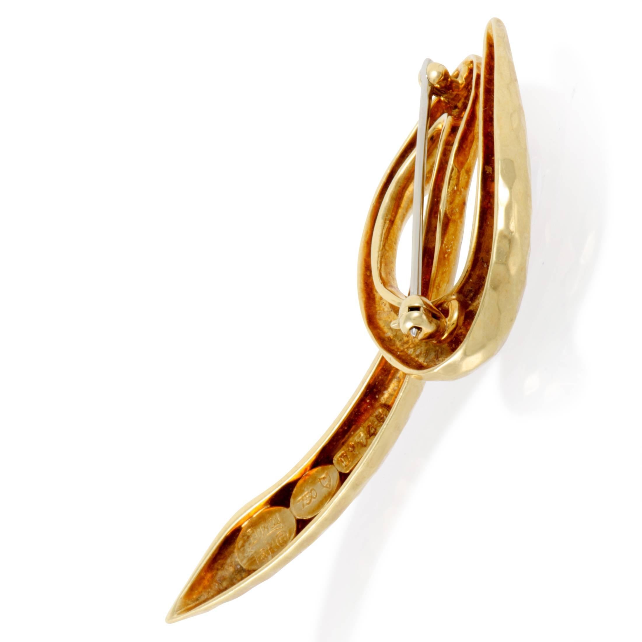 Delightfully graceful shape made of radiant 18K yellow gold is exquisitely polished and marvelously faceted to produce alluring play of light in this fabulous brooch from Henry Dunay which exudes an aura of aesthetic minimalism.