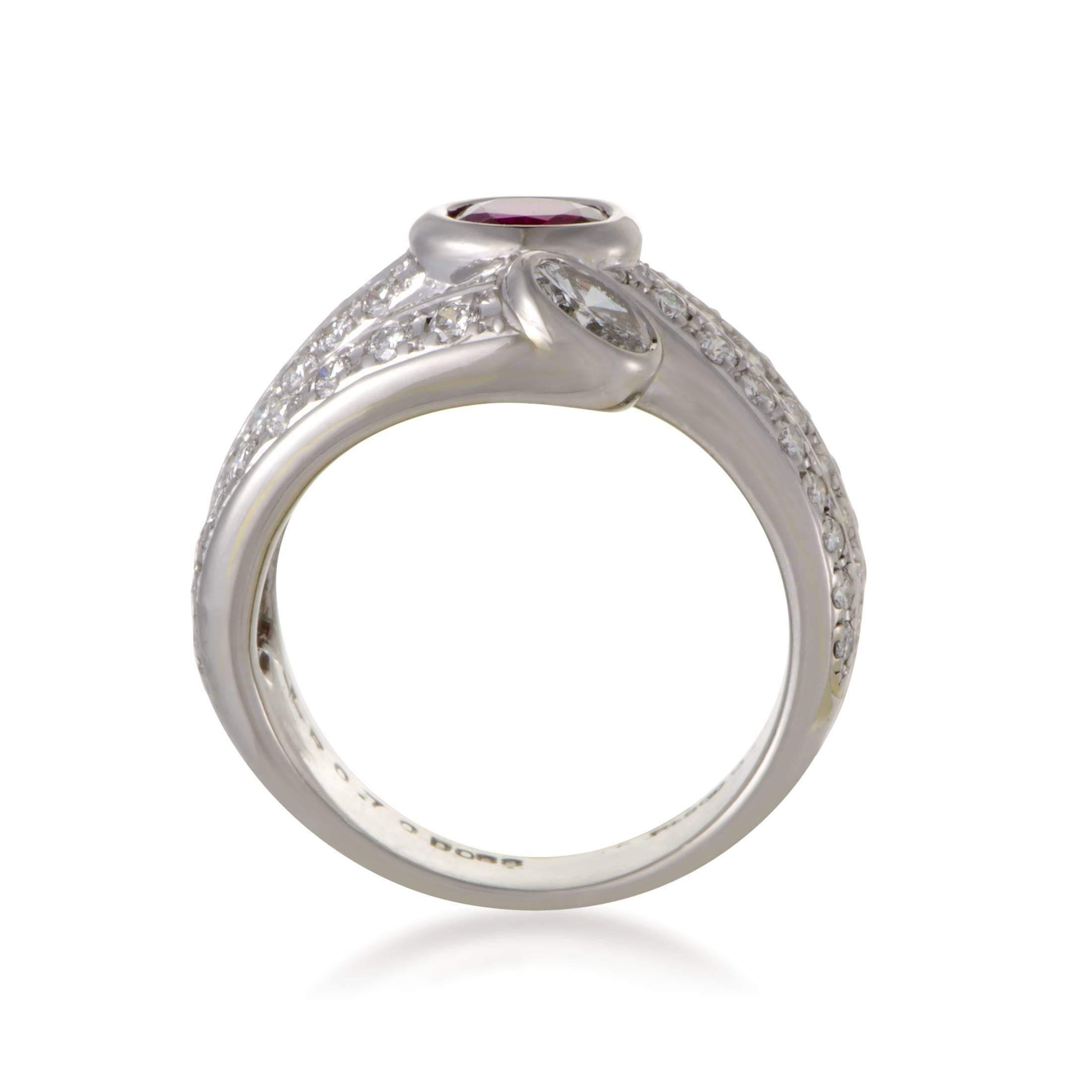 Provided a scintillating backdrop in the form of glistening diamonds totaling 1.39 carats, the gorgeous ruby weighing 0.70ct lends its fabulous color and precious allure to this astonishing ring made of gleaming platinum.
Ring Top Dimensions: 20 x