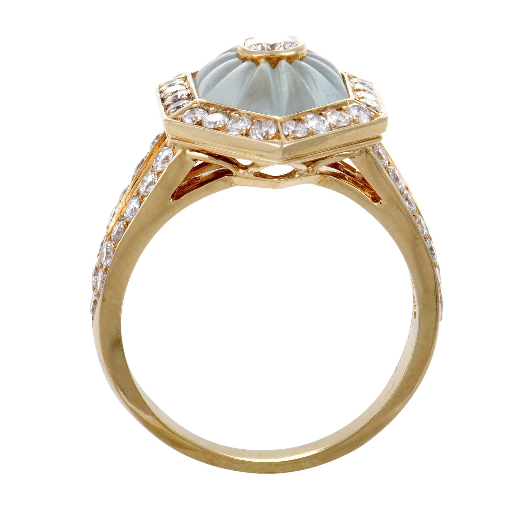 Brilliantly contrasting the gentle tone and smooth shape of the blue crystal, lustrous diamonds weighing in total approximately 1.00 carat compel with their dazzling allure in this fascinating 18K yellow gold ring from Boucheron.
Ring Top