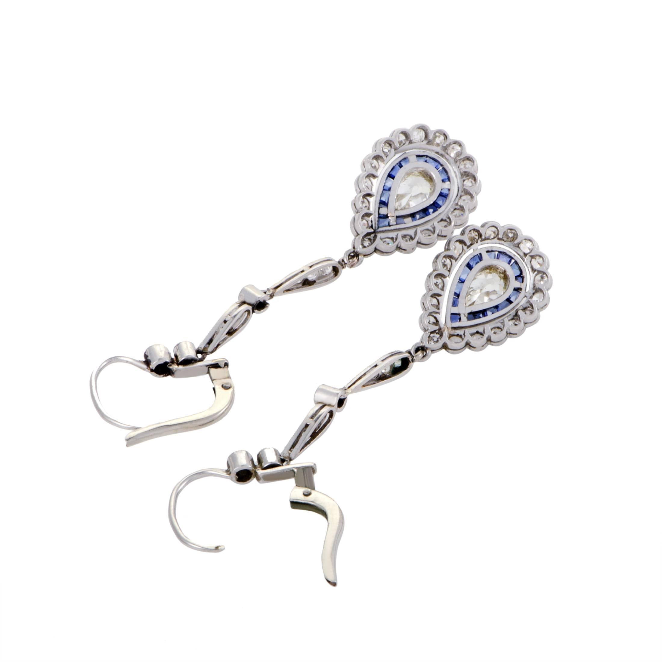 Captivating with their elegant antique style and harmonious blend of refreshing tones, these dazzling platinum earrings are embellished with splendid sapphires amounting to 1.60 carats as well as resplendent diamonds weighing in total approximately