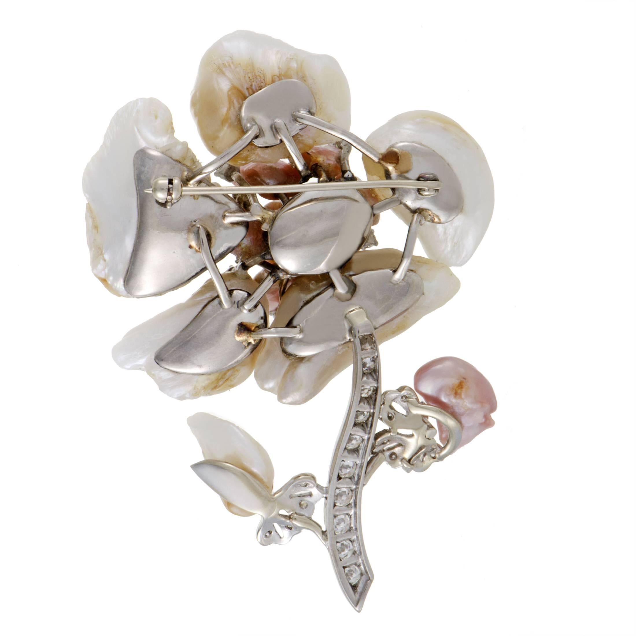 While the spellbinding amorphous baroque pearls create a wonderfully realistic depiction of a flower, splendid 18K white gold and sparkling diamonds amounting approximately to 1.00 carat complete this delightful brooch in harmonious fashion.