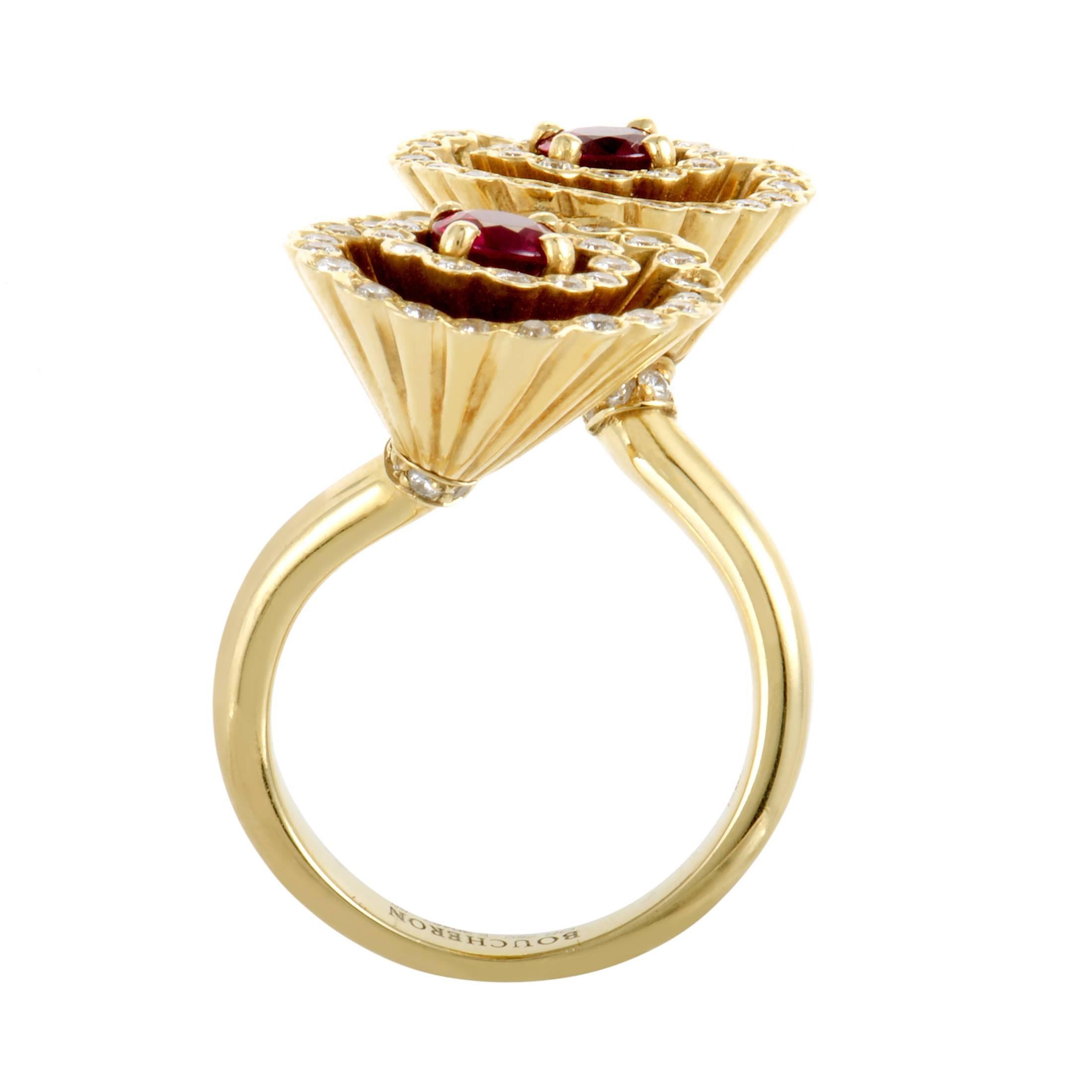 Placed in the middle of wonderfully intriguing shapes and encircled by scintillating arrangements of lustrous diamonds weighing in total 1.00 carat, the precious rubies totaling 0.80ct exude a fabulous allure in this gorgeous 18K yellow gold ring