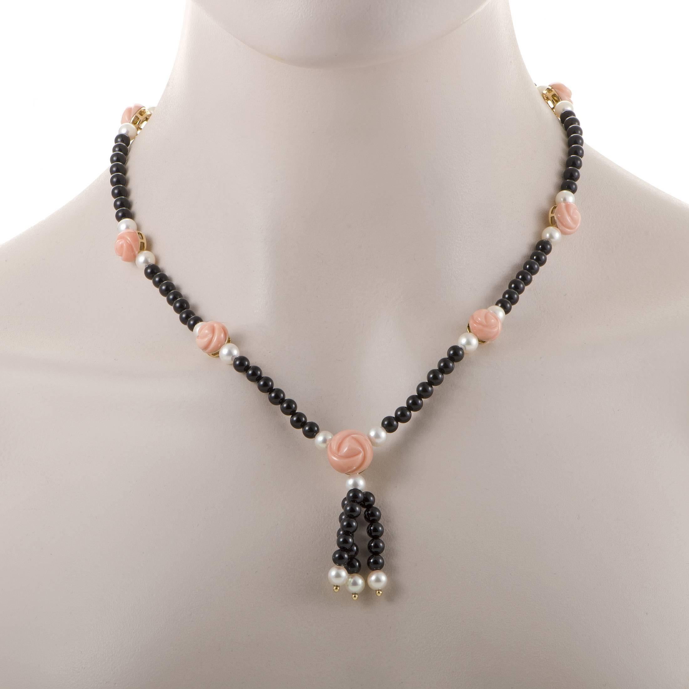 Made of precious 18K yellow gold and completely lined with a fantastic blend of striking onyx beads, delightfully bright pearls and adorable flower-shaped coral stones, this exceptional set of earrings and necklace from Dior offers a slightly