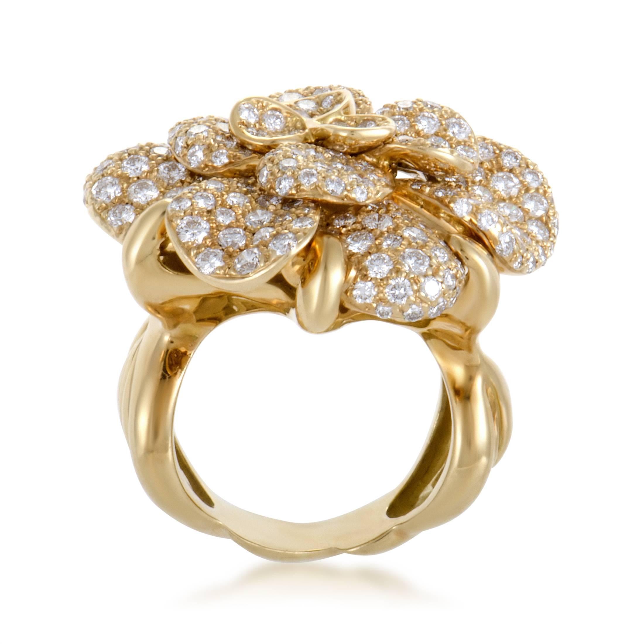 Presenting one of their most iconic motifs in fabulously radiant and delightfully realistic fashion, Chanel created this enchanting 18K yellow gold ring with the compelling camellia flower motif embellished with 250 lustrous diamonds for a dazzling