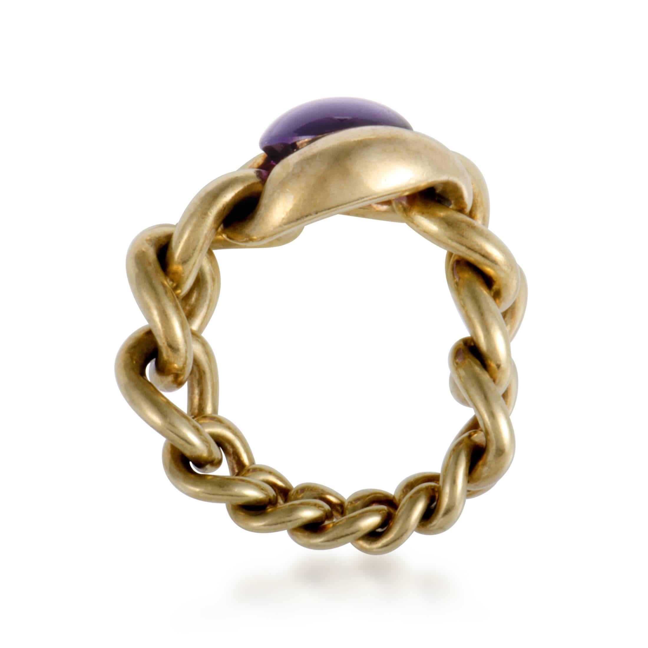 Flowing gracefully and entwining in an intriguingly smooth manner, the radiant 18K yellow gold exudes its intrinsic luxurious allure in this majestic ring from Chanel which is set with a delightful amethyst to add compelling color to the