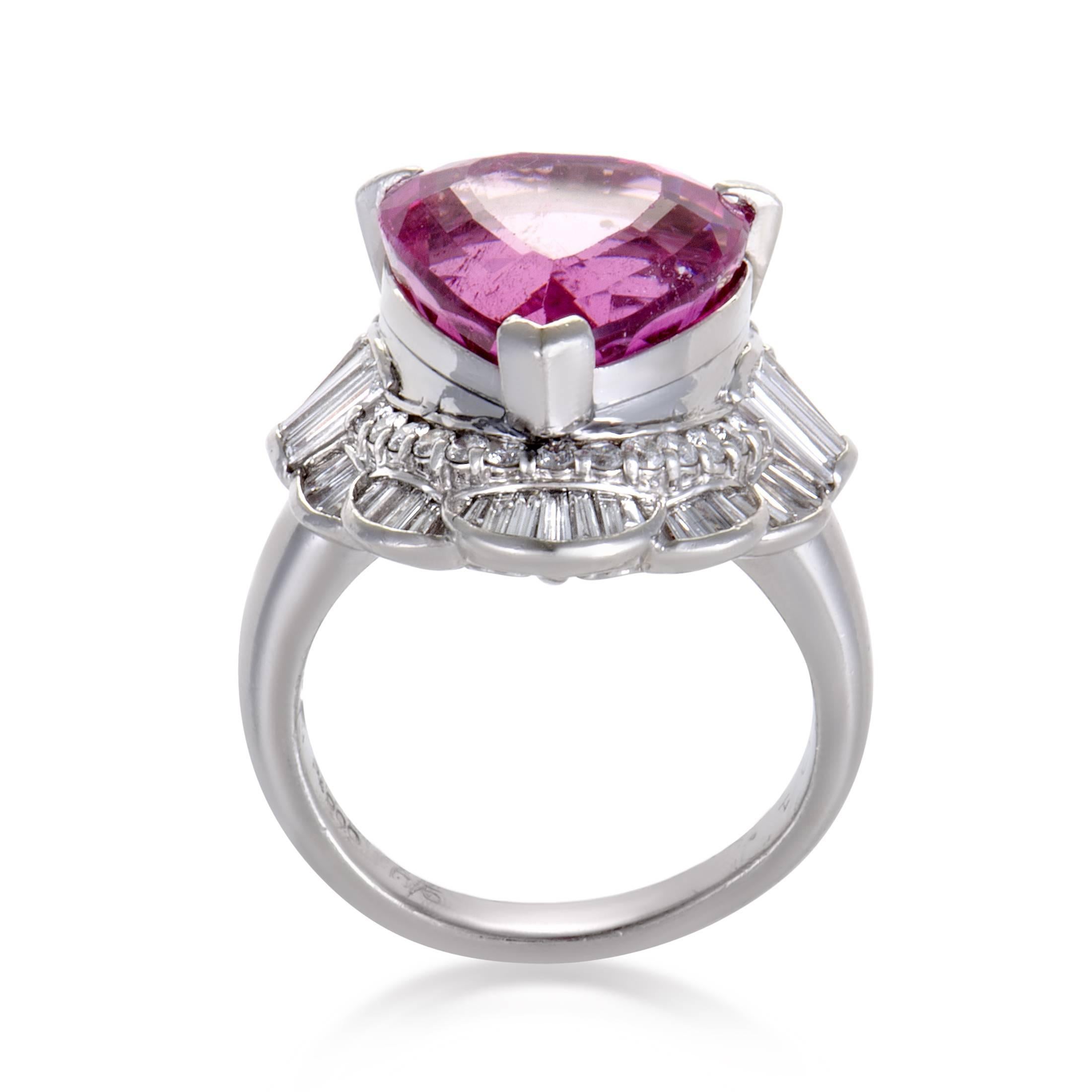Diversely cut and fascinatingly arranged, the mesmerizing diamonds amounting to 1.21 carats produce a resplendent allure against shimmering platinum, providing an astonishing pedestal for the majestic pink tourmaline weighing 10.54 carats in this