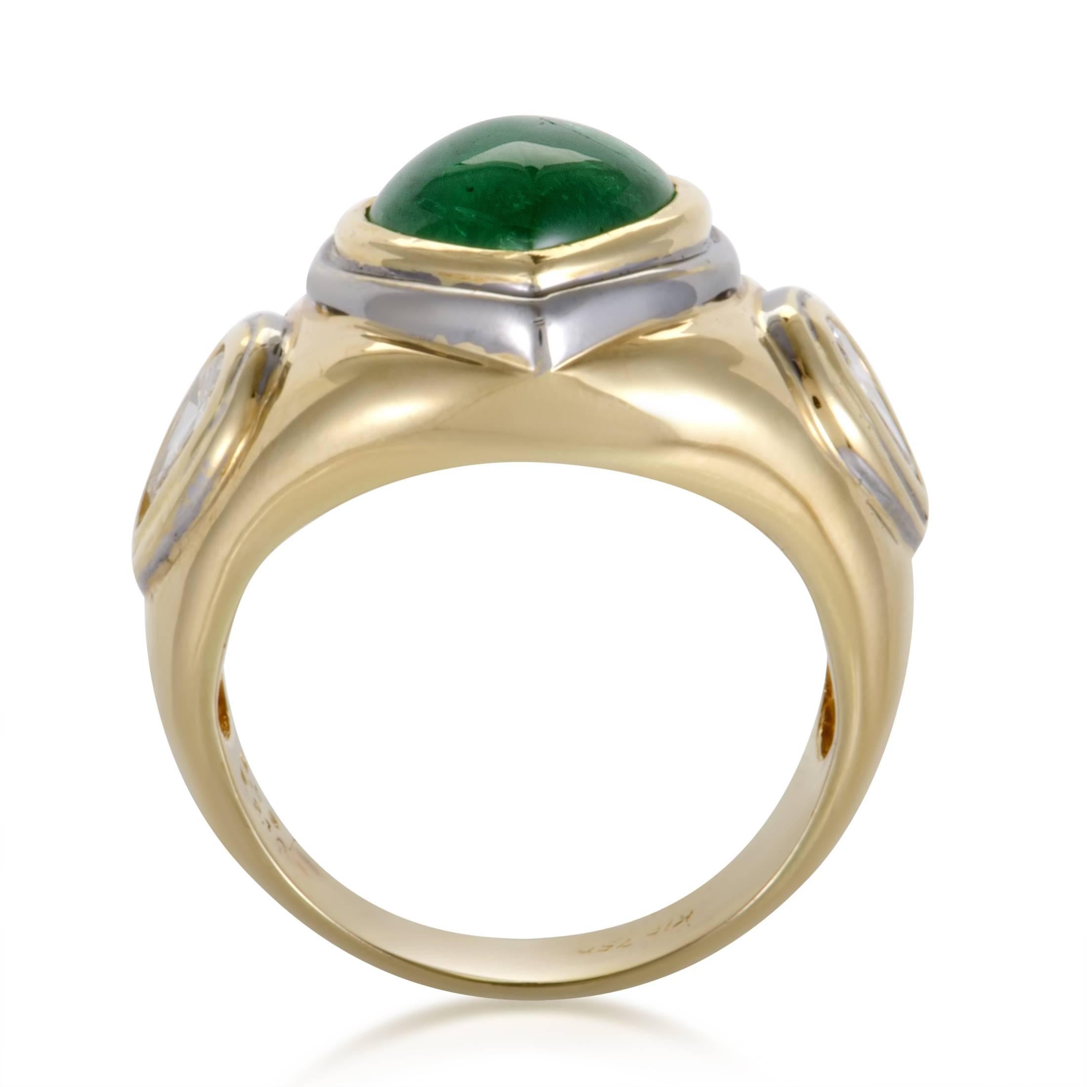 Made of a prestigious blend of 18K yellow and white gold, this marvelous ring boasts a gracefully smooth shape perfectly followed by the nifty emerald weighing 2.10 carats as well as the glistening diamonds amounting to 0.63ct for an adorable