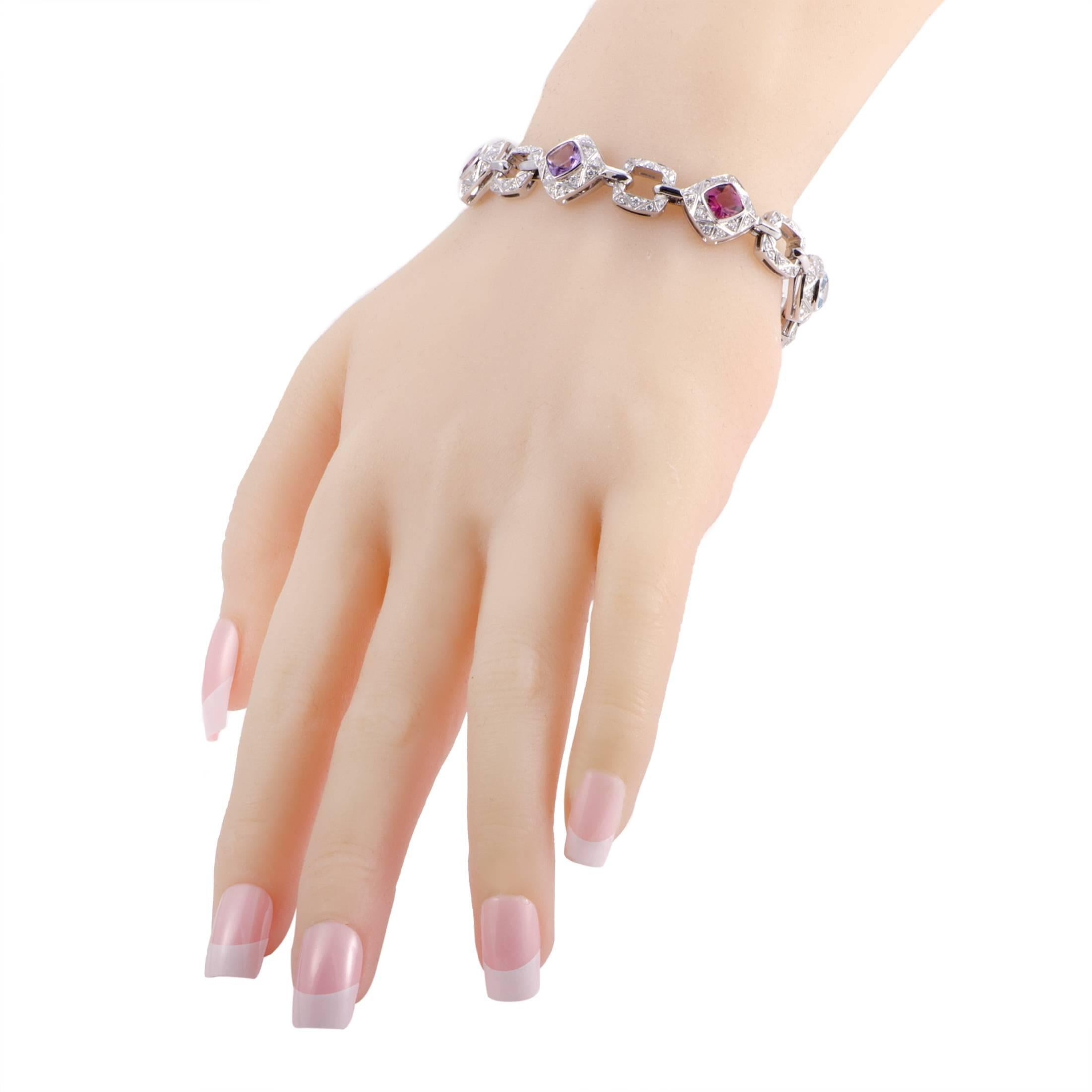 The joyous and exuberant blend of colorful gems includes gorgeous aquamarines and tourmalines as well as marvelous amethysts and iolite stones in this charming bracelet from Asprey which is made of splendid 18K white gold and embellished also with