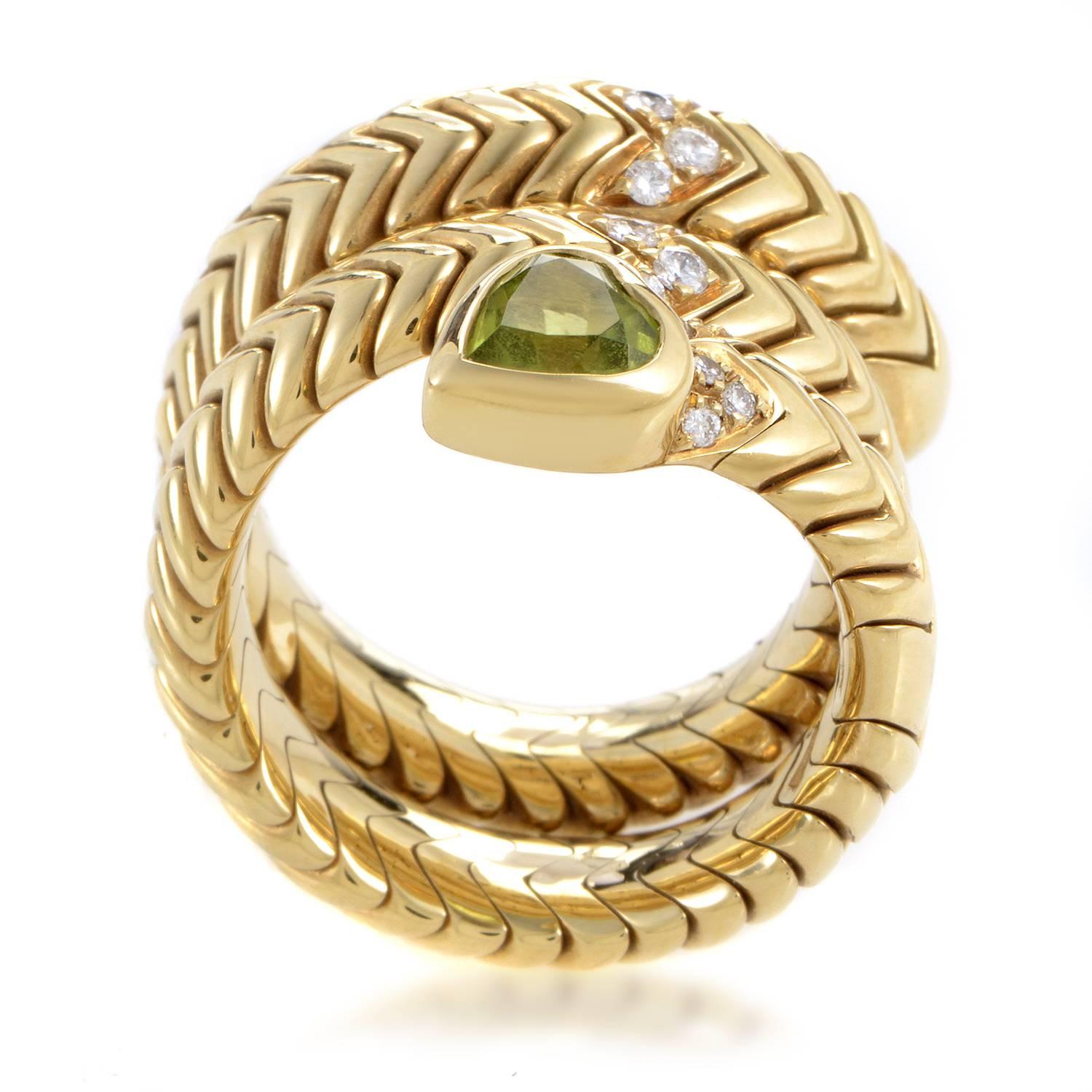 Curling around your finger in graceful snake-like manner, the fabulous 18K yellow gold boasts an intriguing texture which leads your eye up to the splendid peridot stone while sparkling diamonds totaling 0.25ct embellish the upper part of this