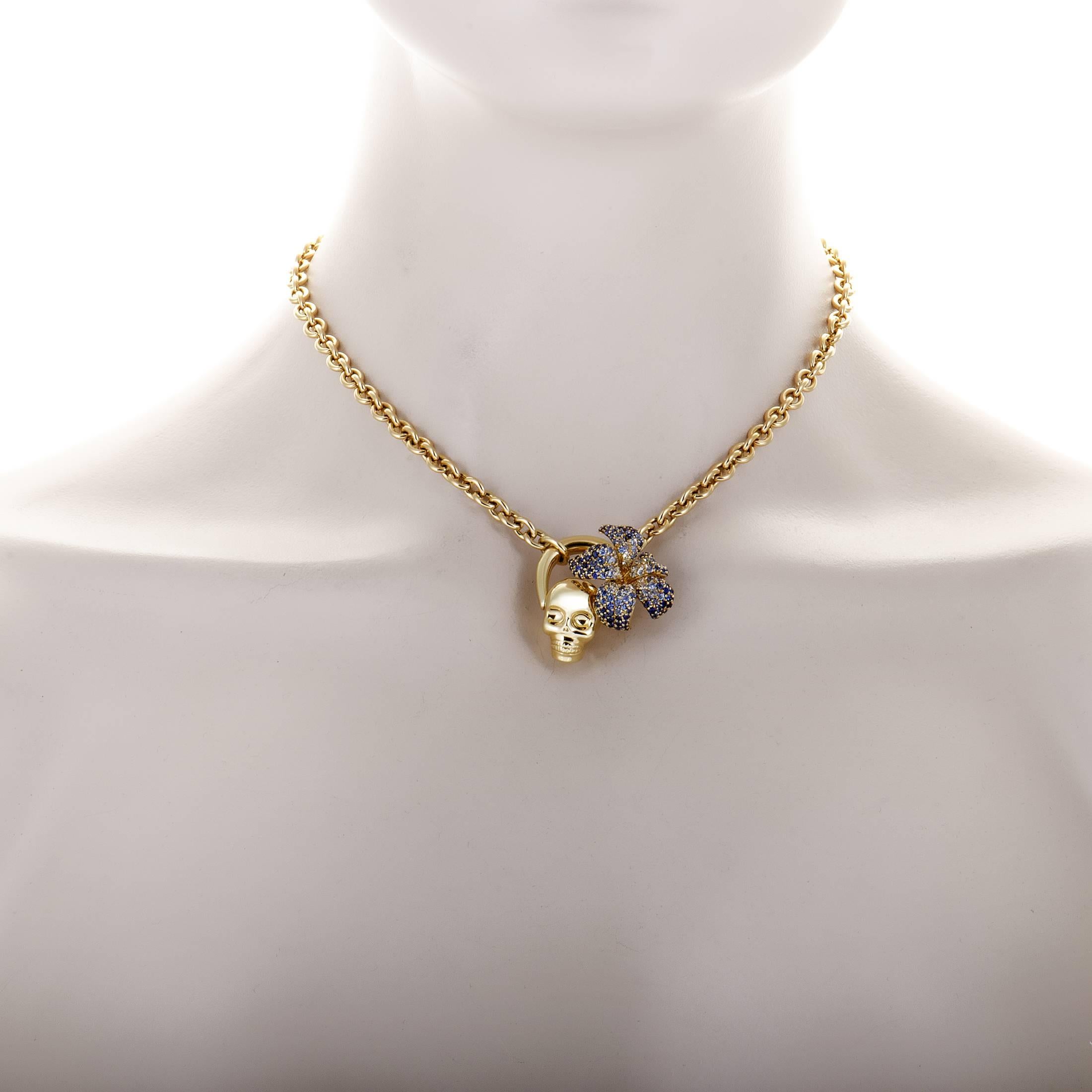 Embellished with splendid sapphires arranged in a magnificent fashion upon the gorgeous flower decoration, this remarkable 18K yellow gold necklace from Gucci's Flora collection also features an intriguing skull motif for a memorable sight.
Pendant