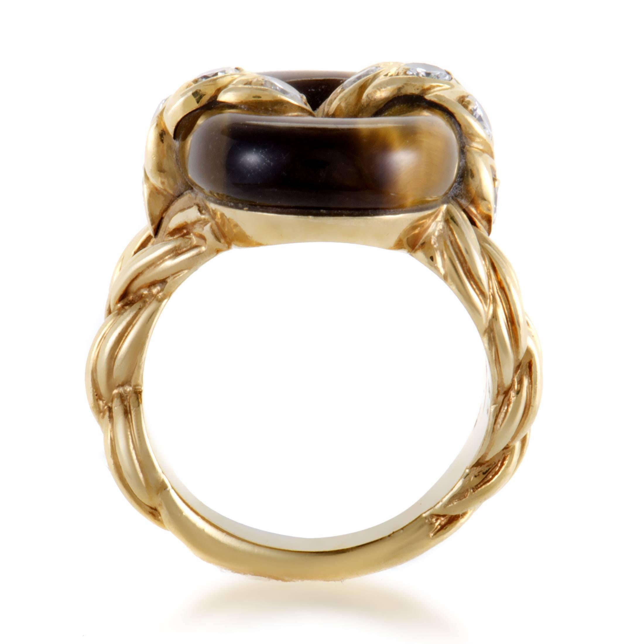 Exquisitely ornamented 18K yellow gold, expertly set diamonds weighing in total 0.48ct and remarkably shaped tiger eye stone create a magnificent appearance in this sublime vintage ring from Van Cleef & Arpels.
Included Items: Manufacturer's