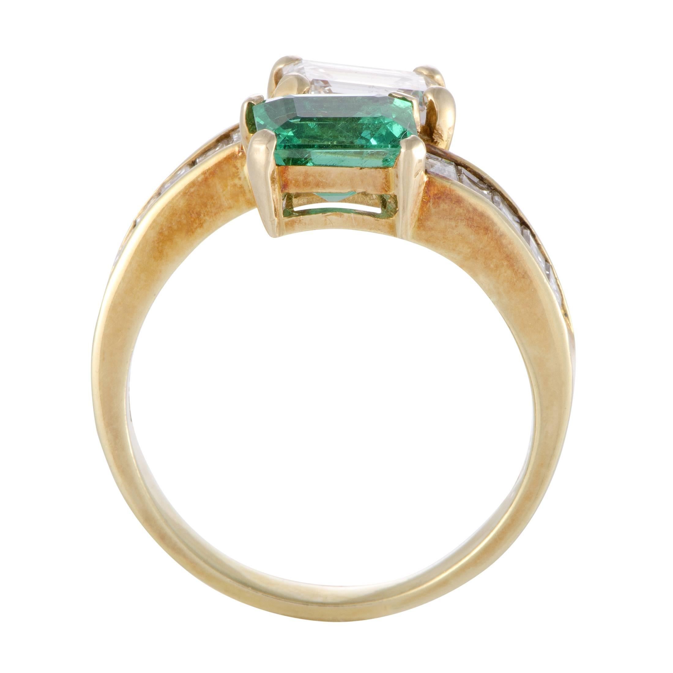 Compelling with their exquisite cut, the vivid emeralds weighing 1.20 carats and majestic central diamond weighing 1.02 carats are brilliantly complemented by the glistening side diamonds amounting to 1.12 carats in this magnificent 18K yellow gold