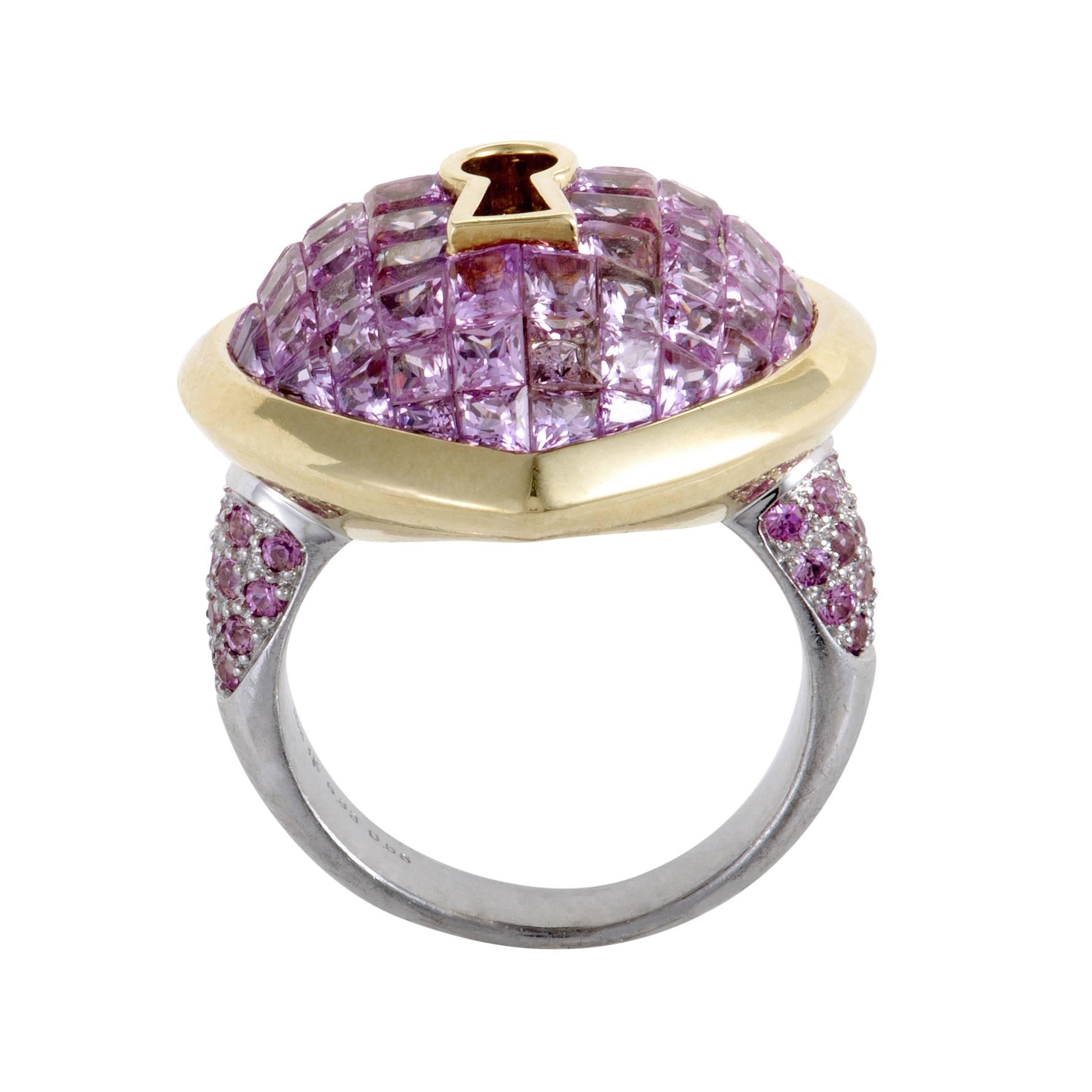 Intriguing motifs, precious materials and fabulous colors produce a spellbinding sight in this sublime ring which boasts the marvelous shape of a keyhole inside a romantic heart while delightful pink sapphires totaling 6.89 carats are set upon 18K