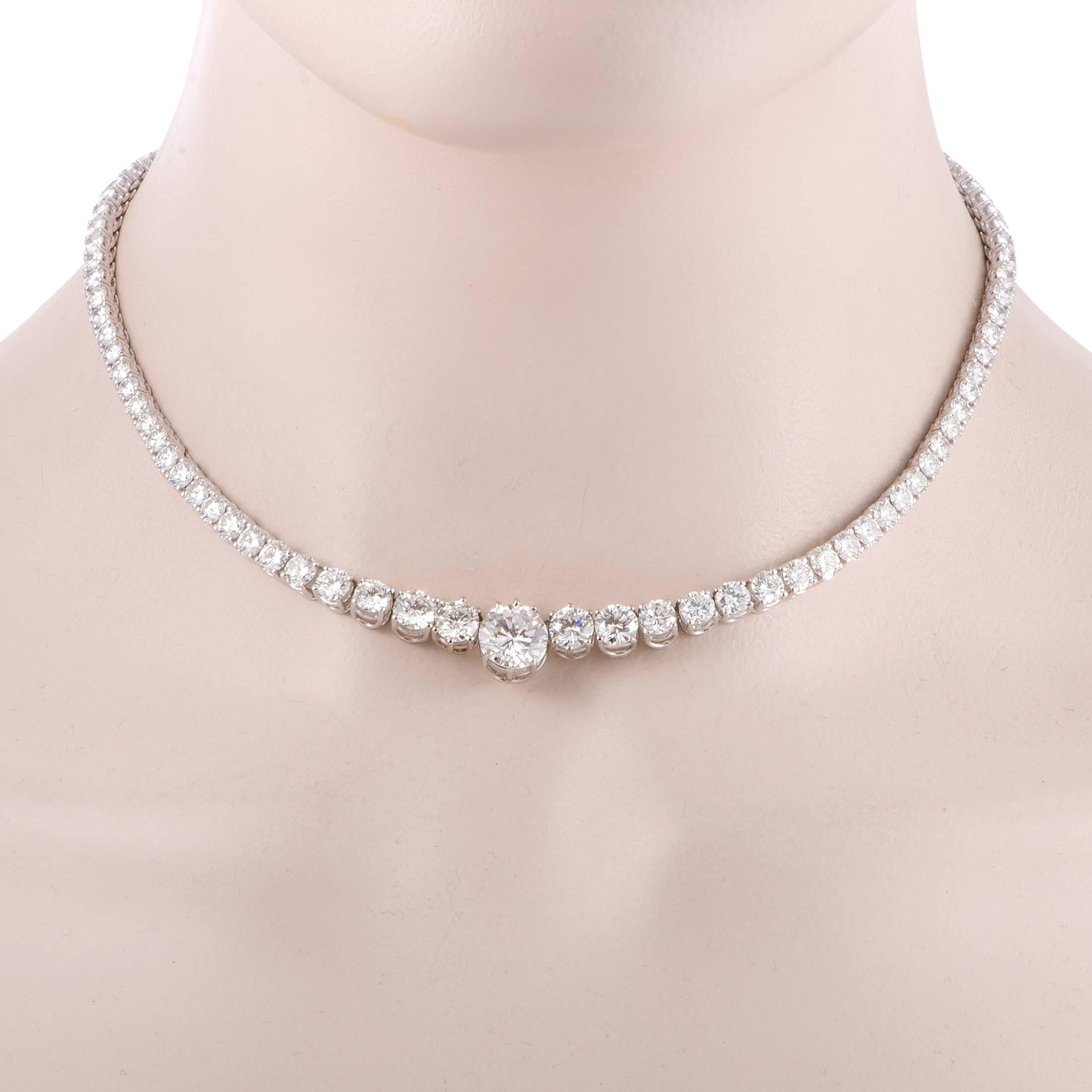 Lined with expertly cut and marvelously lustrous diamonds weighing in total 20.50 carats, this magnificent necklace is made of shimmering 18K white gold and boasts a majestic central F-color diamond of VVS1 clarity weighing 3.08 carats for a