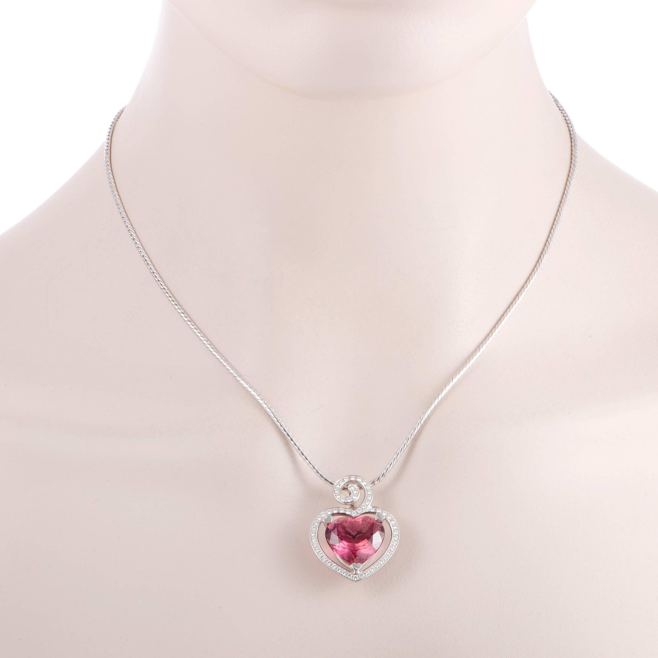 Exquisitely cut, gorgeously strong in color and boasting the romantic shape of a heart, the astounding pink tourmaline weighing approximately 9.00 carats is placed at the heart of this fascinating necklace from Breguet which also features shimmering