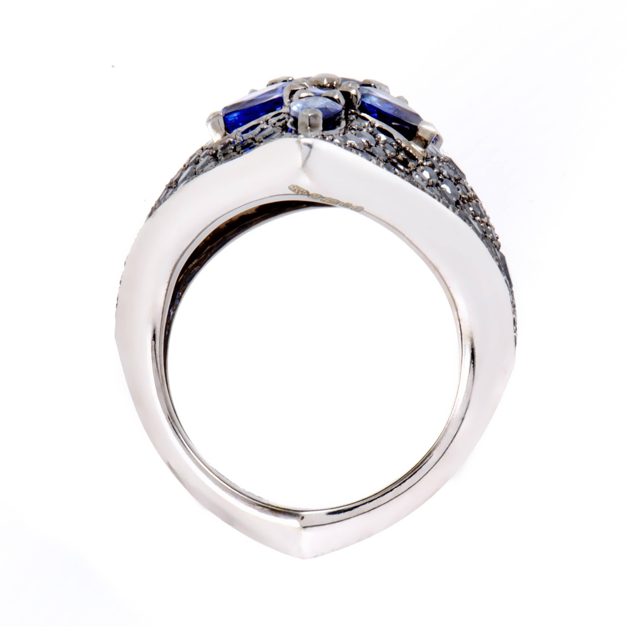 The ever-captivating combination of splendid black diamonds and alluringly regal blue sapphires is featured in this stunning ring from Stephen Webster presented within the majestic “Belle Epoque” collection. The ring is made of prestigious 18K white
