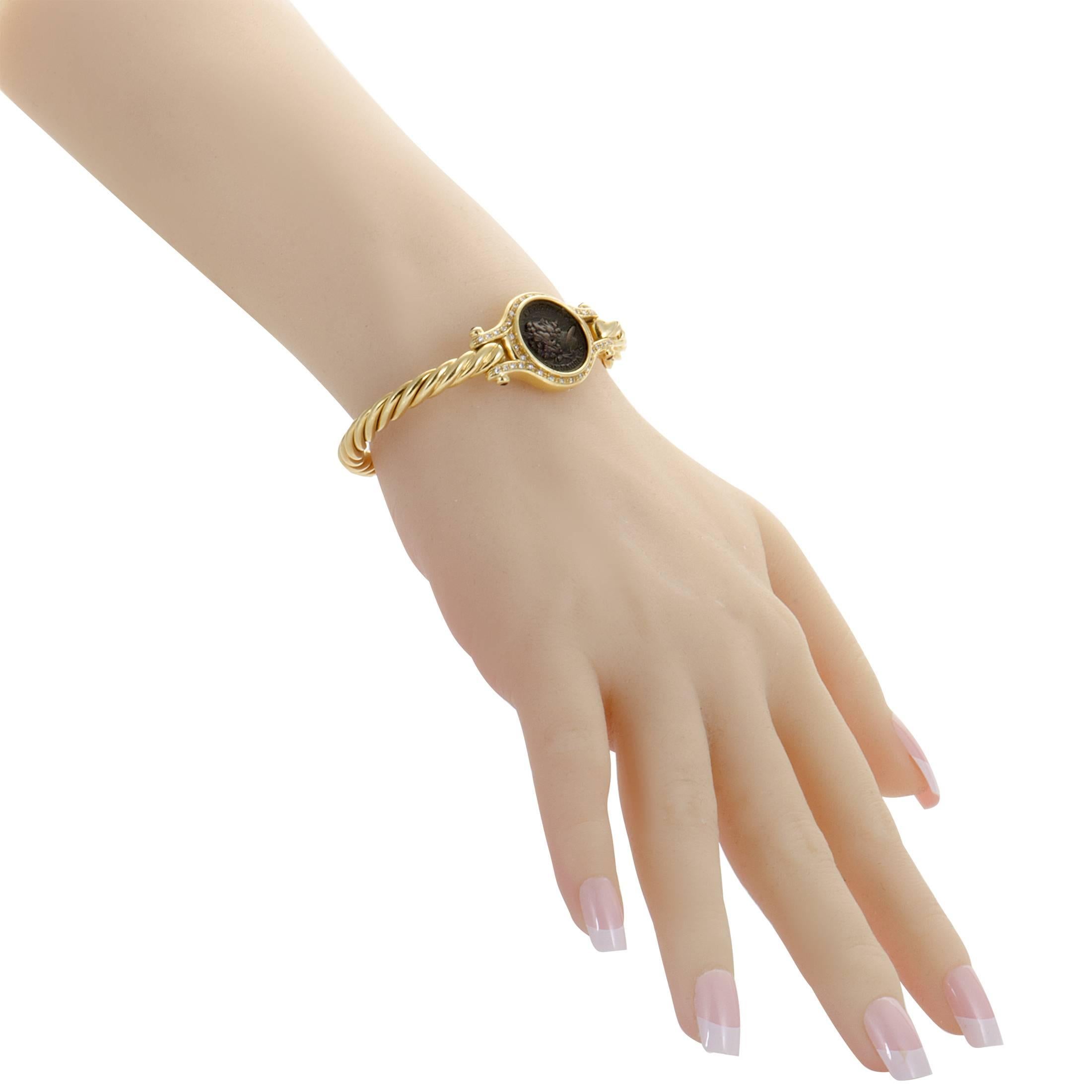 Harmoniously combining the classic elegant allure of 18K yellow gold with endearing antique appeal of the ancient coin, this stunning bracelet offers tasteful offbeat appearance. The bracelet is embellished with rubies and 0.40 carats of