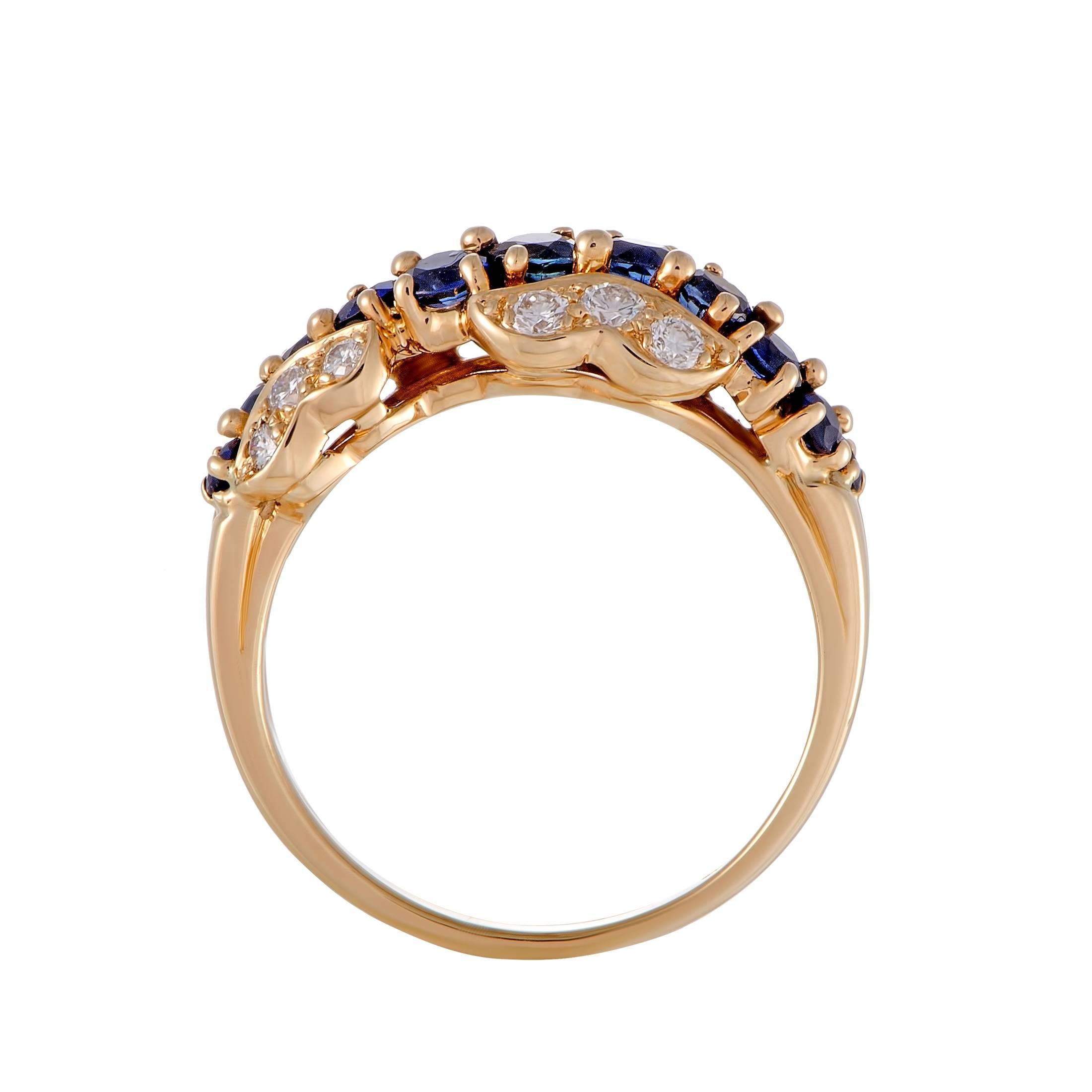 The ever-alluring prestigious combination of resplendent white diamonds and regal blue sapphires is wonderfully complemented with luxuriously radiant 18K yellow gold in this stunning ring designed by Oscar Heyman. The sapphires total 0.50 carats and