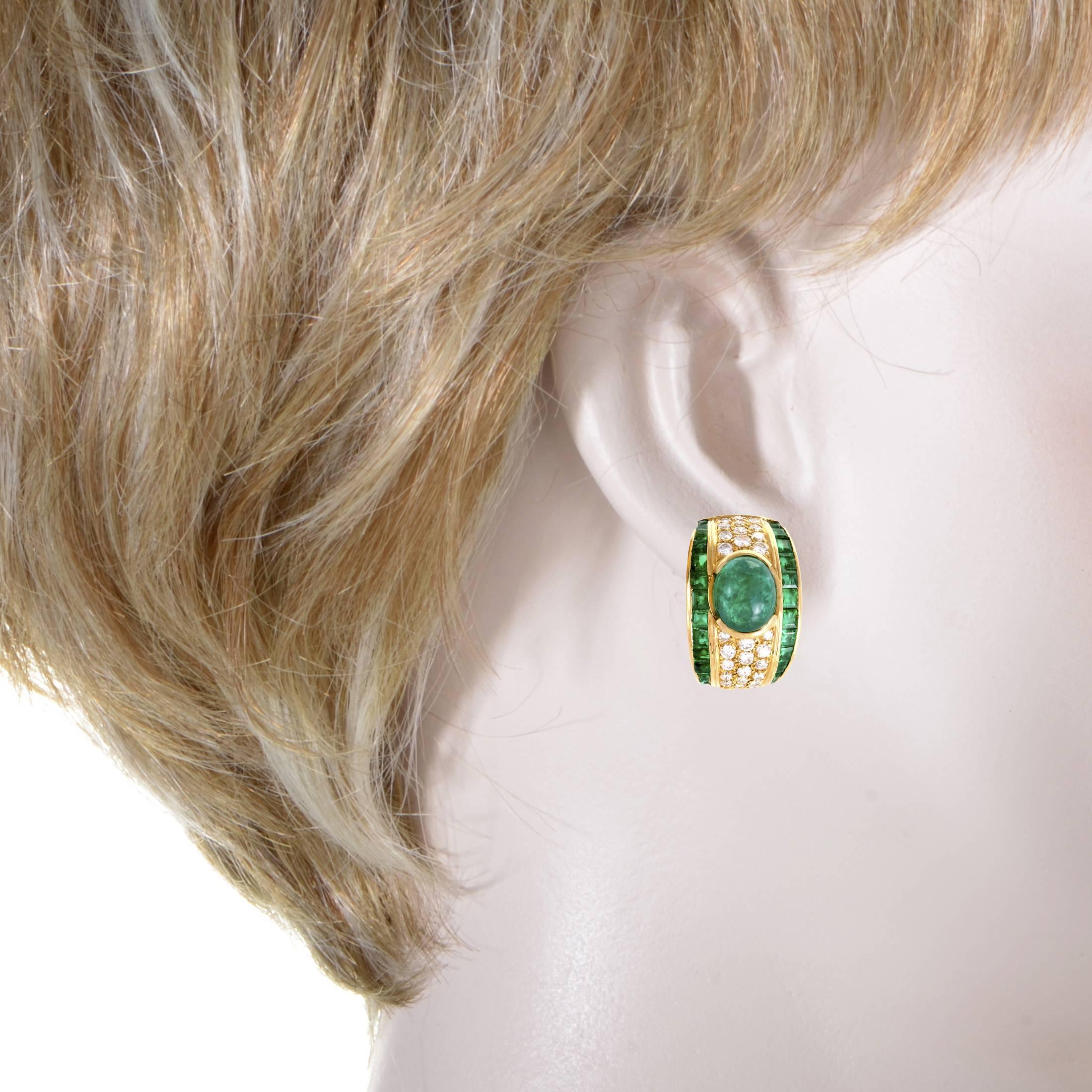 Featuring the luxurious combination of sparkly diamonds and regal emeralds complemented splendidly by radiant 18K yellow gold, these stunning earrings offer a wonderfully refined appearance. The emeralds total approximately 8.50 carats and the