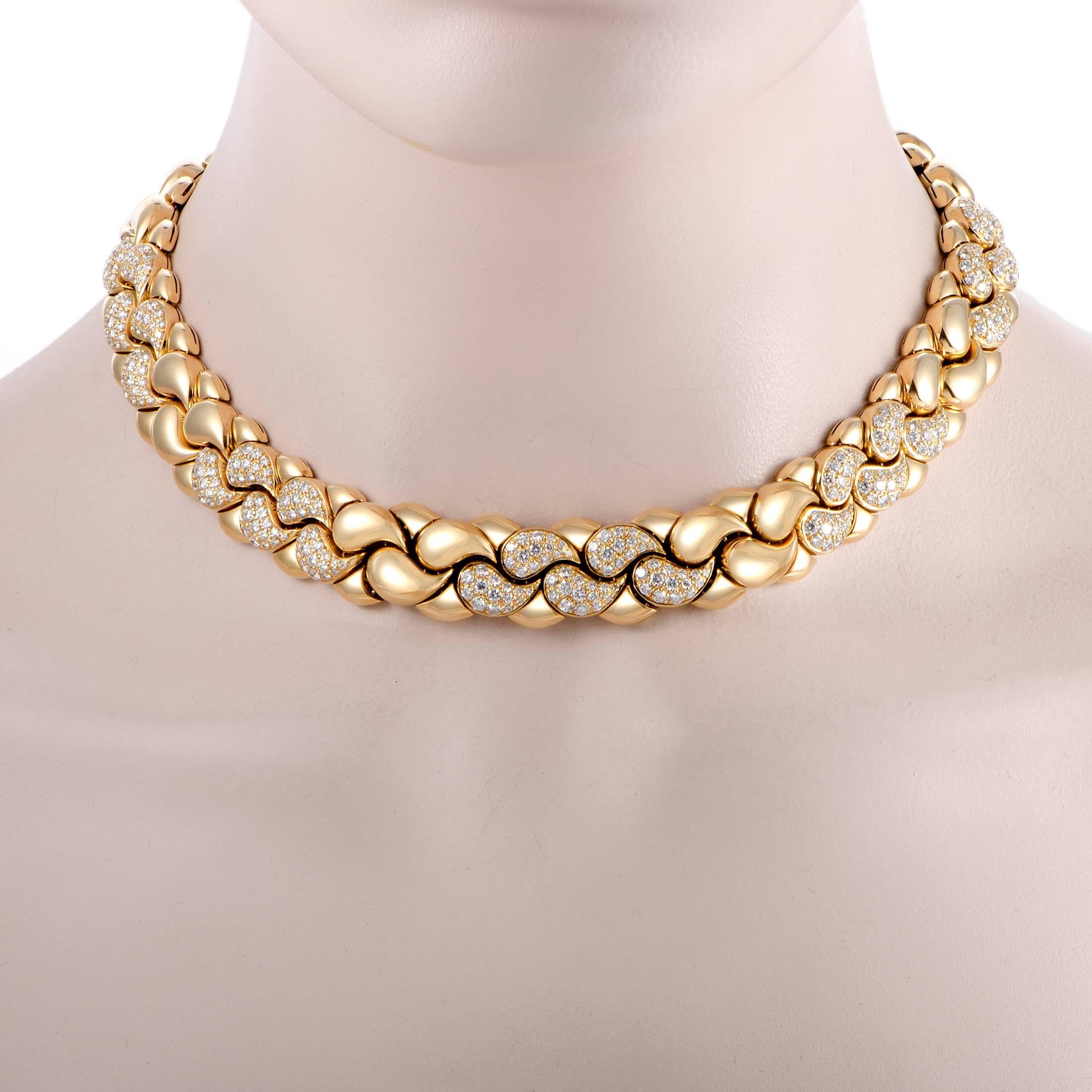 Presented within the “Casmir” collection by Chopard, this stunning necklace boasts an incredibly bold, fashionable appearance. It is made of radiant 18K yellow gold and embellished with glamorous diamonds that total approximately 7.75