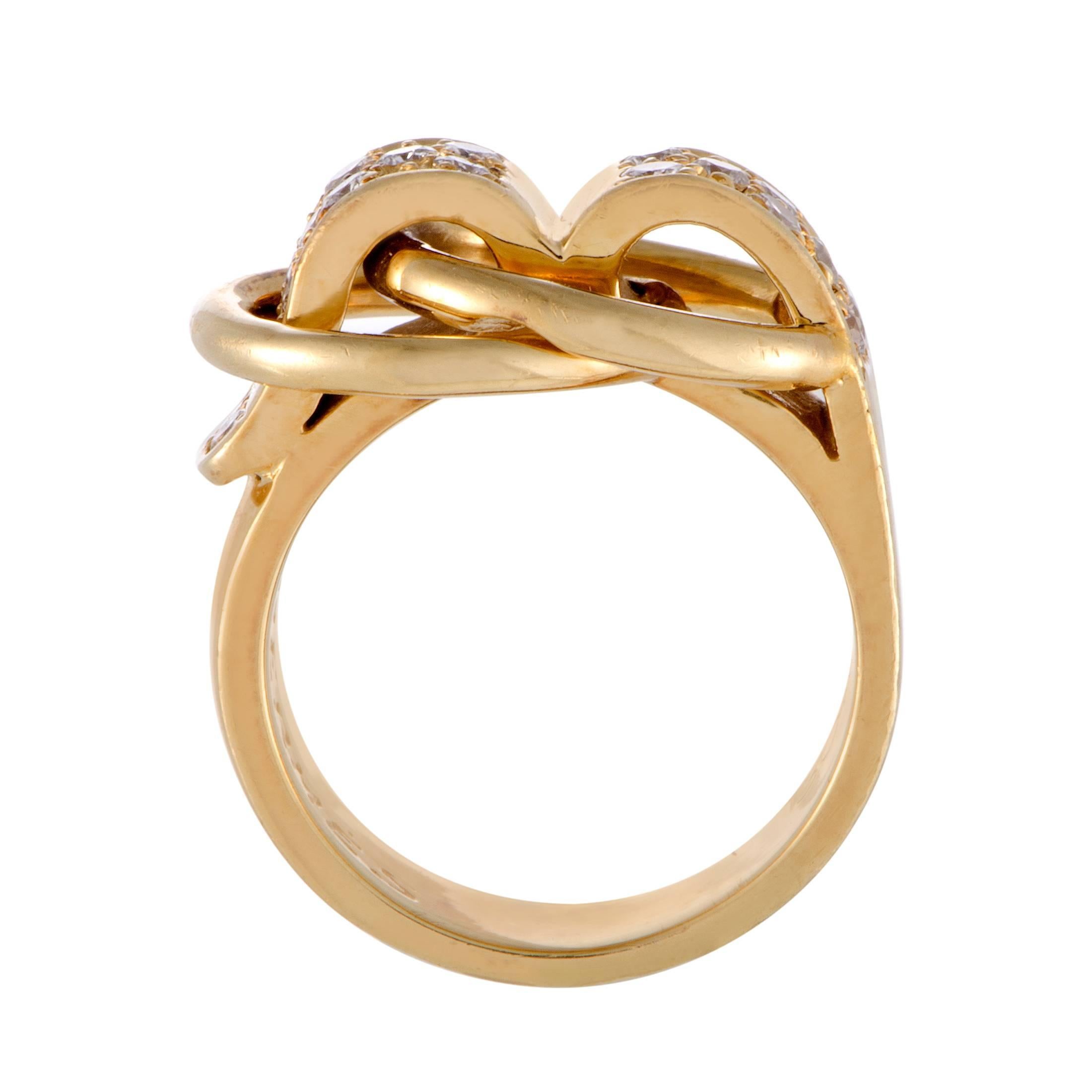 Featuring the distinct design elements the brand is known for, this splendid ring boasts an exquisitely offbeat, fashionable allure. Presented by Hermès, the ring is made of 18K yellow gold and set with a total of 0.50 carats of sparkly