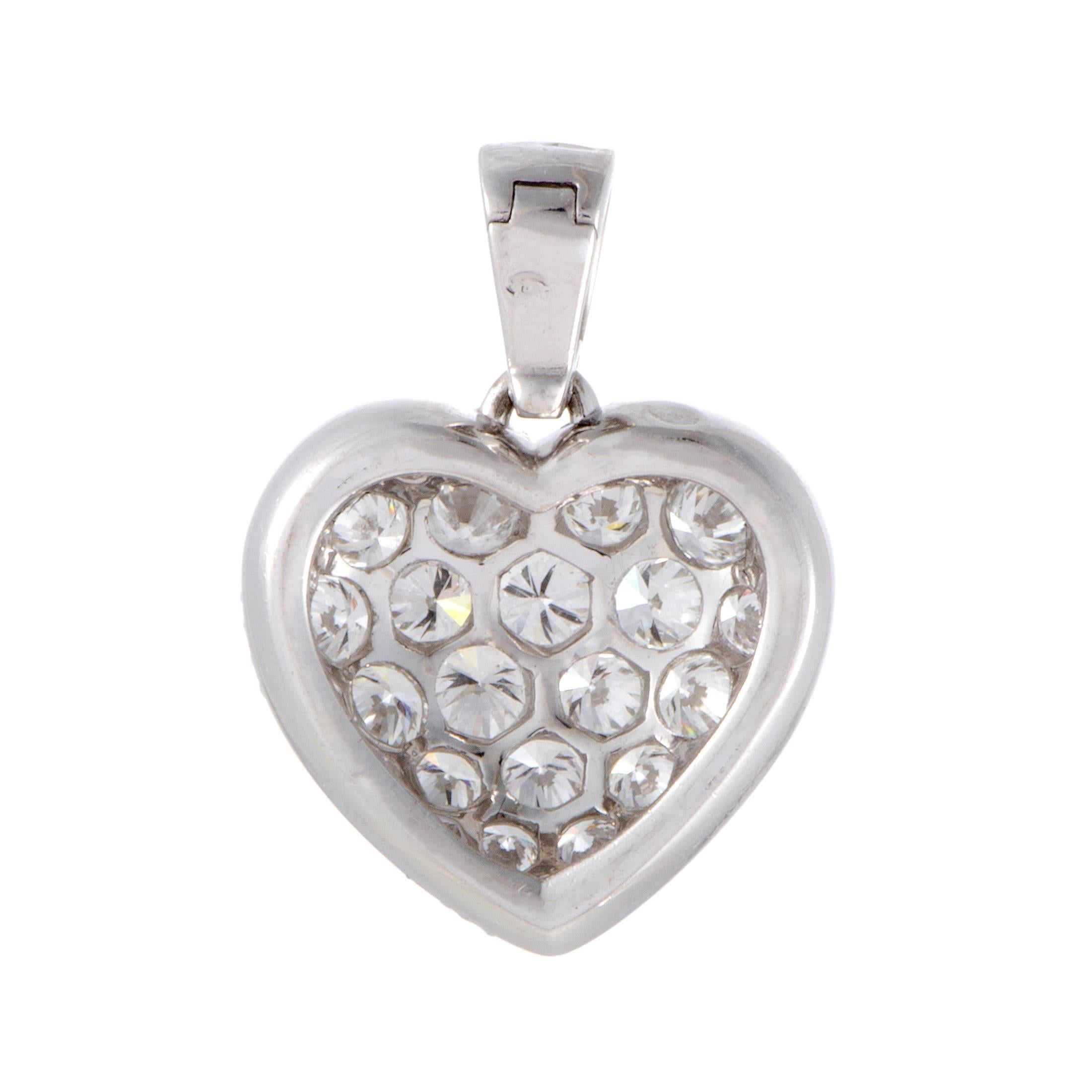 Charm and beauty are embodied in this gorgeous pendant by Cartier. It is glamorously designed in the shape of a heart in 18K white gold, completely paved with twinkling 1.25ct of F-color, VVS1 clarity diamonds that shine beautifully against the