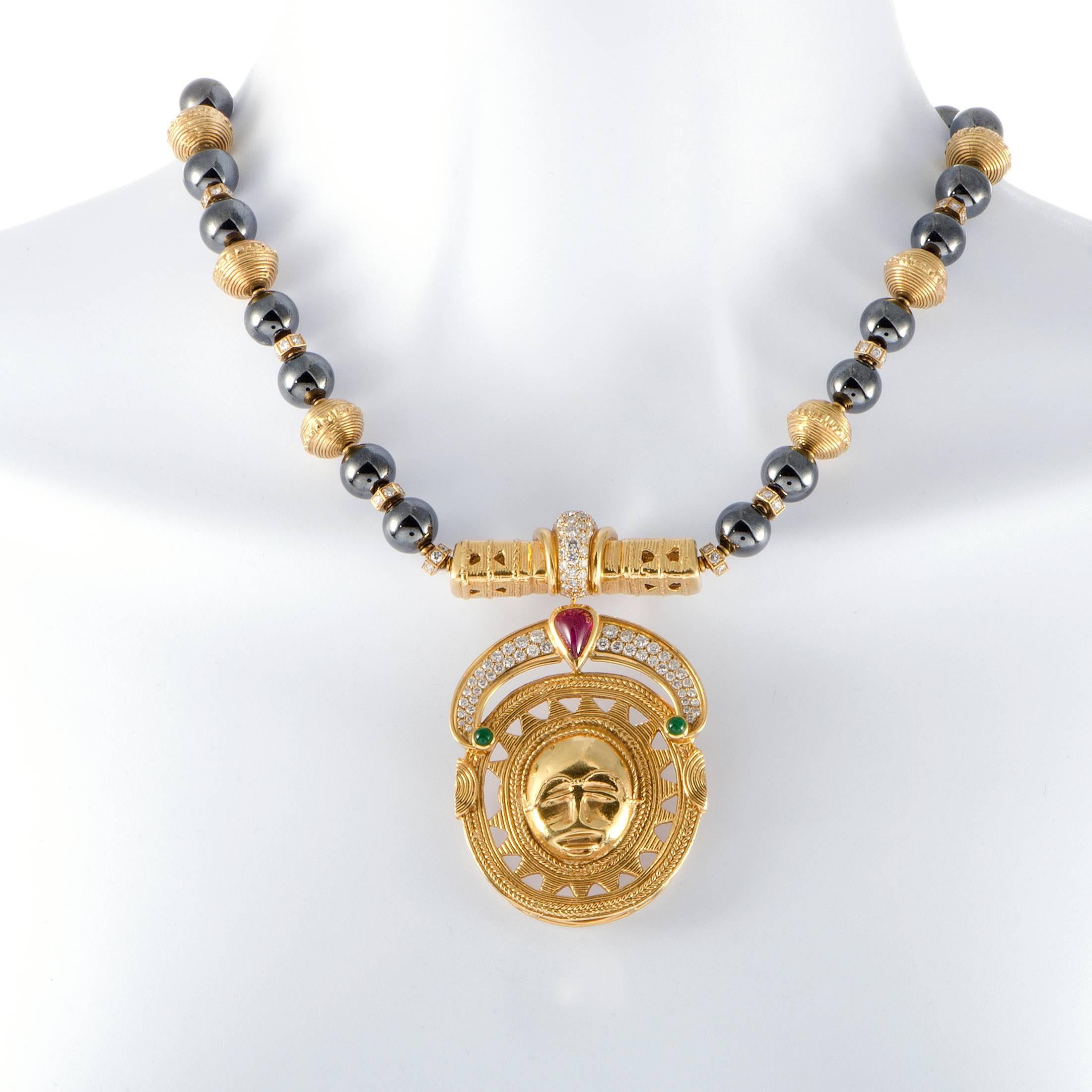 Comprised of 18K yellow gold and hematite beads and featuring an incredibly eye-catching pendant, this necklace boasts a remarkably fashionable appeal. Designed by Boucheron, it also features emeralds, a ruby and 1.75 carats of diamonds.
Pendant
