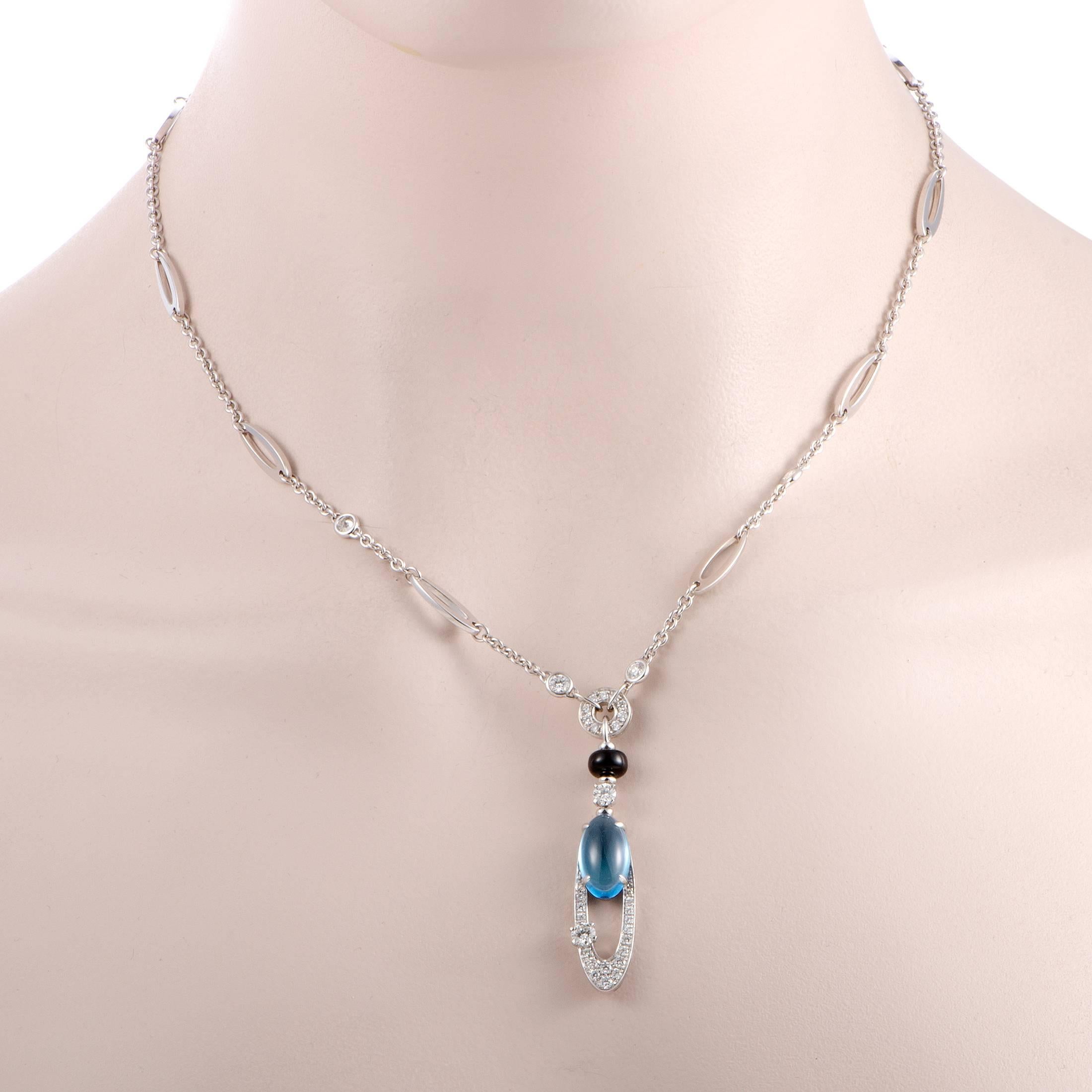 This utterly exquisite necklace from Bulgari's Elisia collection is one-of-a-kind! Not only does this 18K white gold necklace have sparkling diamonds on its pendant, but it also has a gorgeous topaz cabochon and a stunning onyx bead that fit