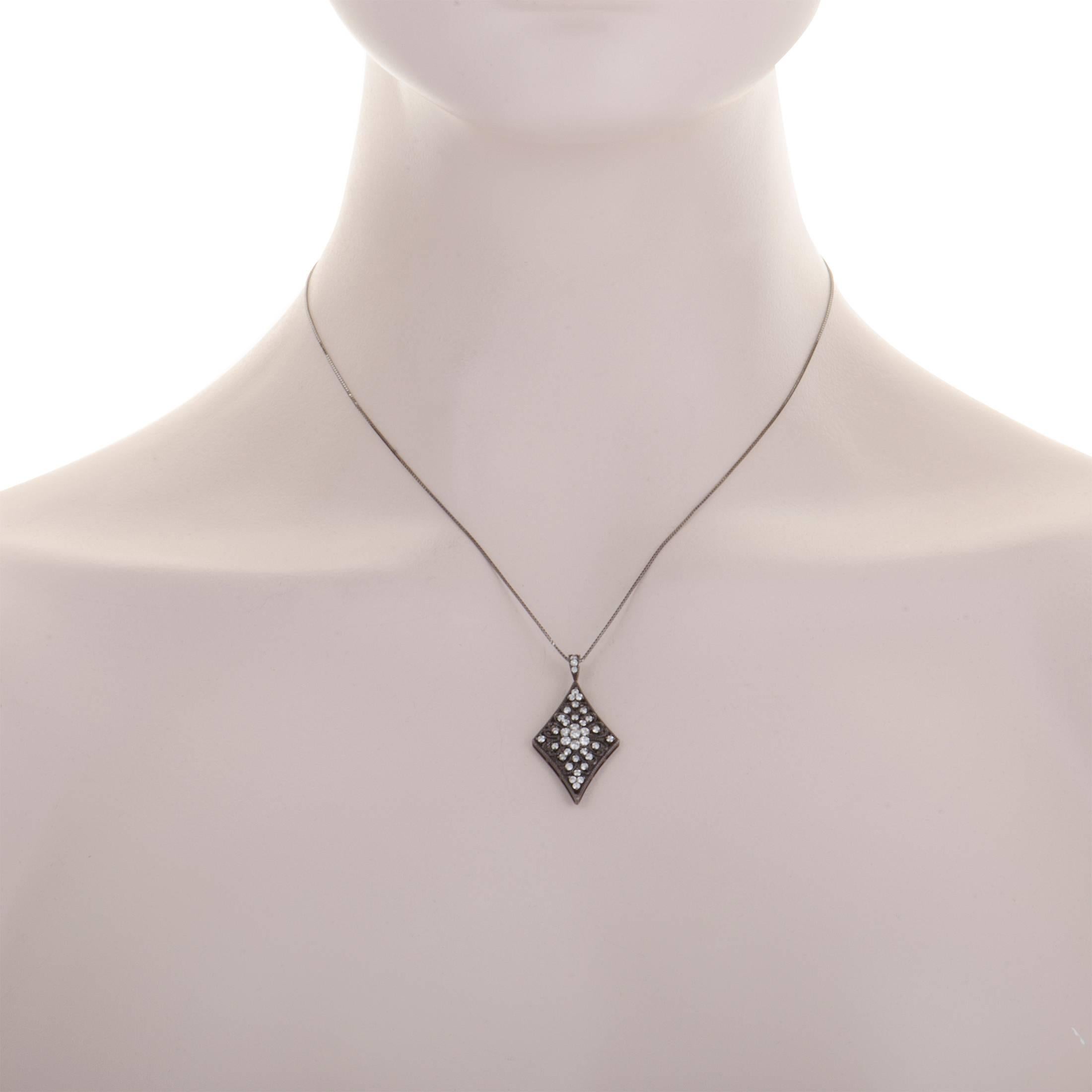 Plated with black rhodium, this 18K white gold necklace offers an incredibly eye-catching, offbeat appearance. The pendant features nifty intricate décor and it is set with scintillating diamonds that weigh in total 0.70 carats.
Pendant Dimensions: