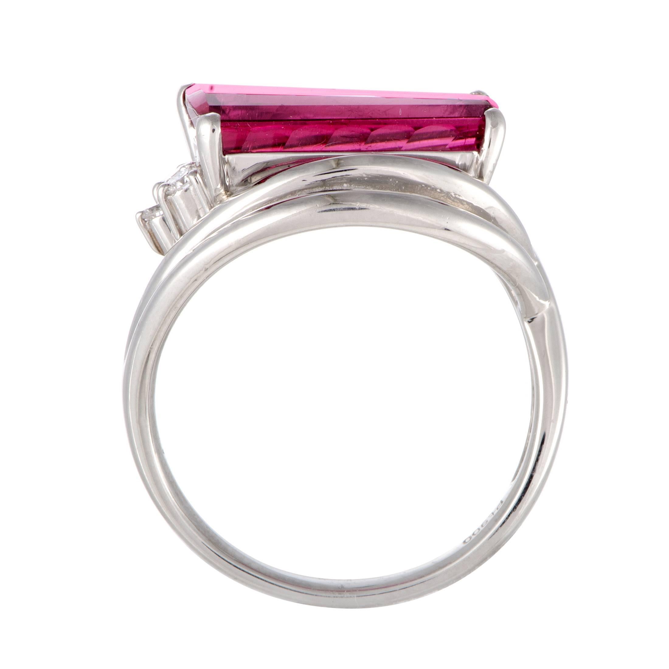 The striking pink tourmaline takes the central place in this superb ring made of prestigious platinum that boasts an endearingly fashionable appeal. The tourmaline weighs 4.40 carats and the ring is also set with diamond stones that total 0.16