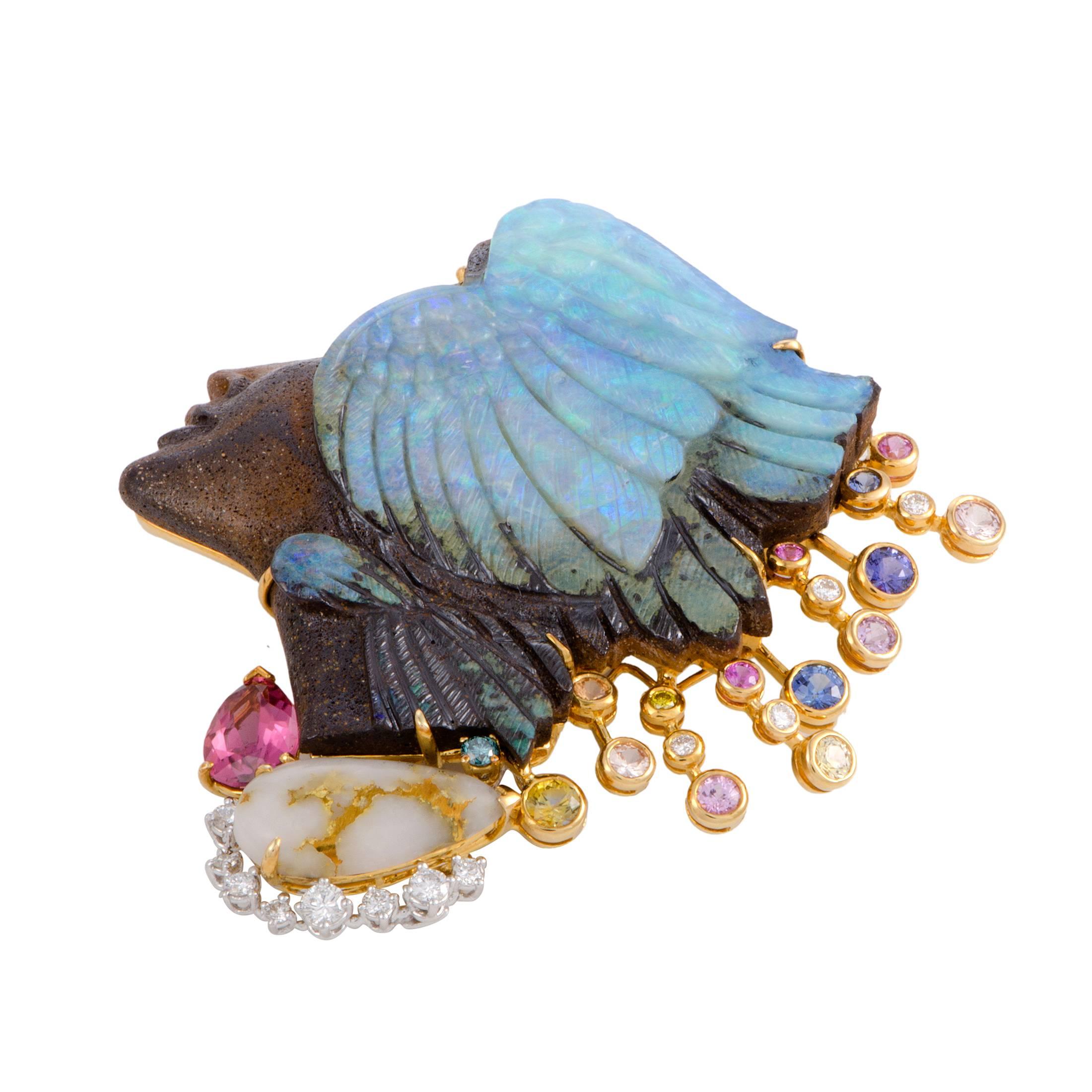 A plethora of diverse stones and colors creates a stunning visual effect in this eye-catching brooch that depicts a lady’s profile in an incredibly imaginative fashion. Made of 18K yellow gold and platinum, the brooch is decorated with diamond,