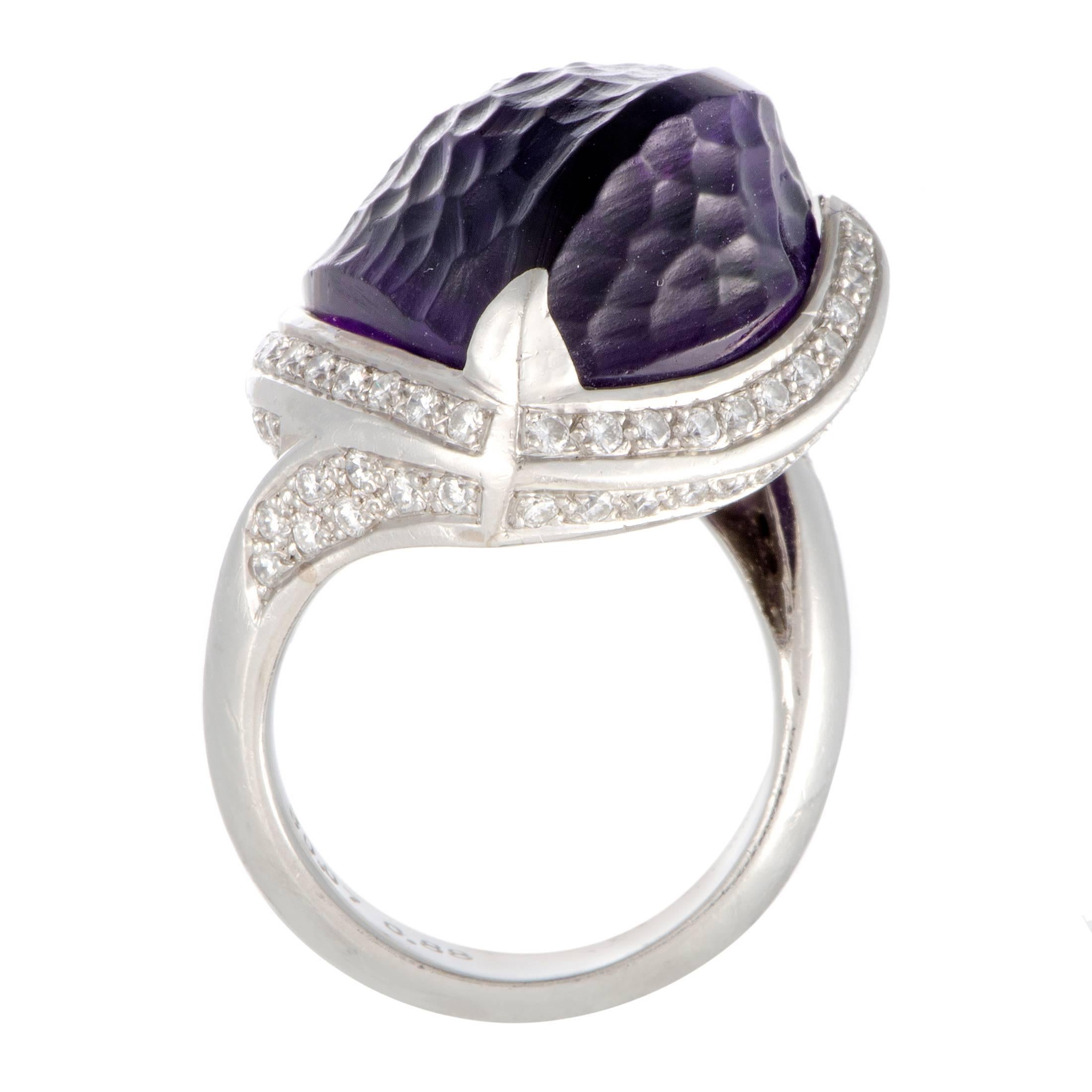 The intriguing cut of the spectacular amethyst adds to the compelling beauty of this superb jewelry piece that offers an exceptionally extravagant appearance. The ring is made of prestigious platinum and set with diamonds that total 0.88 carats,