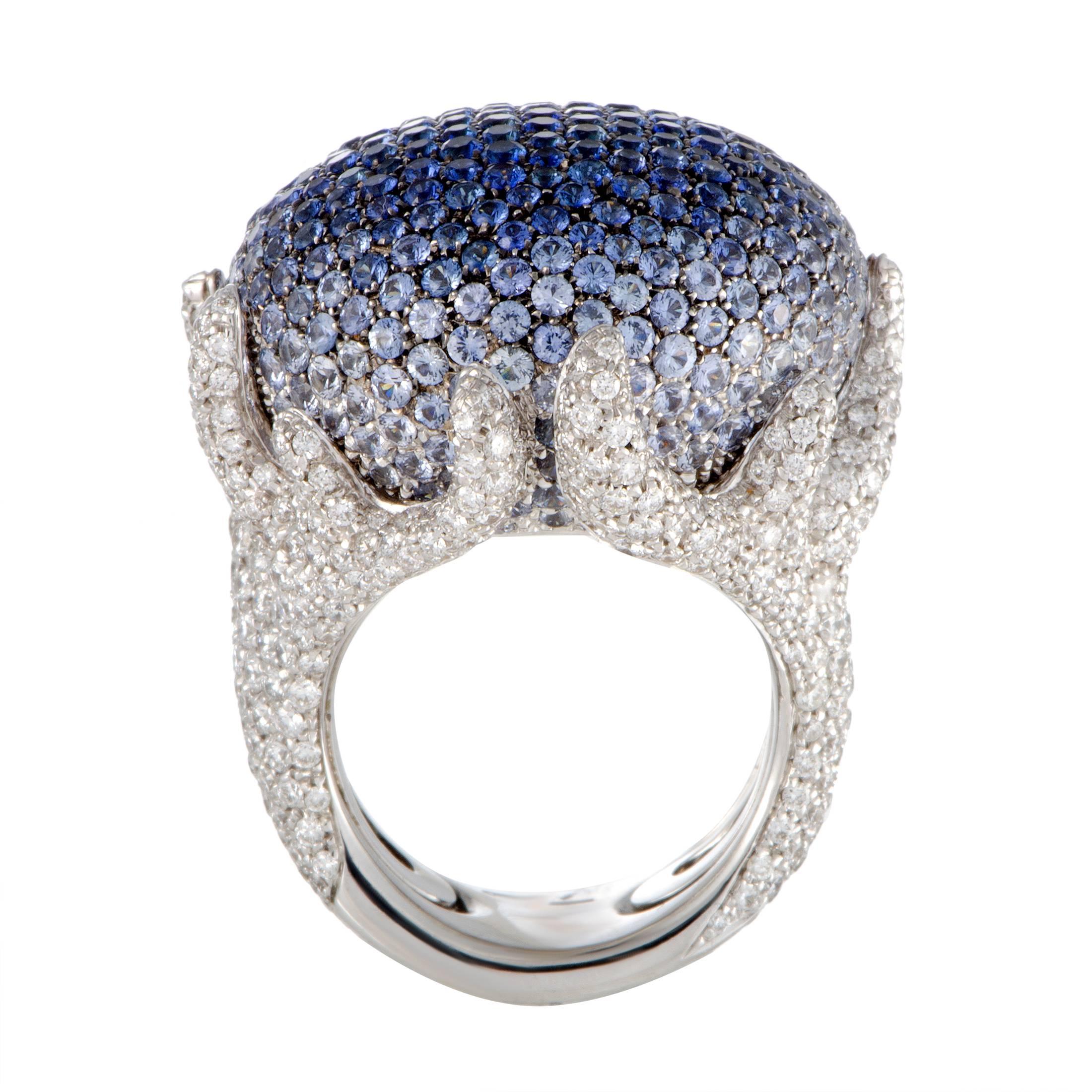 Lavishly paved with diamonds and sapphires, this stunning ring designed by Palmiero exudes elegance and extravagance. The ring is made of prestigious 18K white gold and weighs 39.6 grams, while the sapphires total 8.73 carats and the nearly