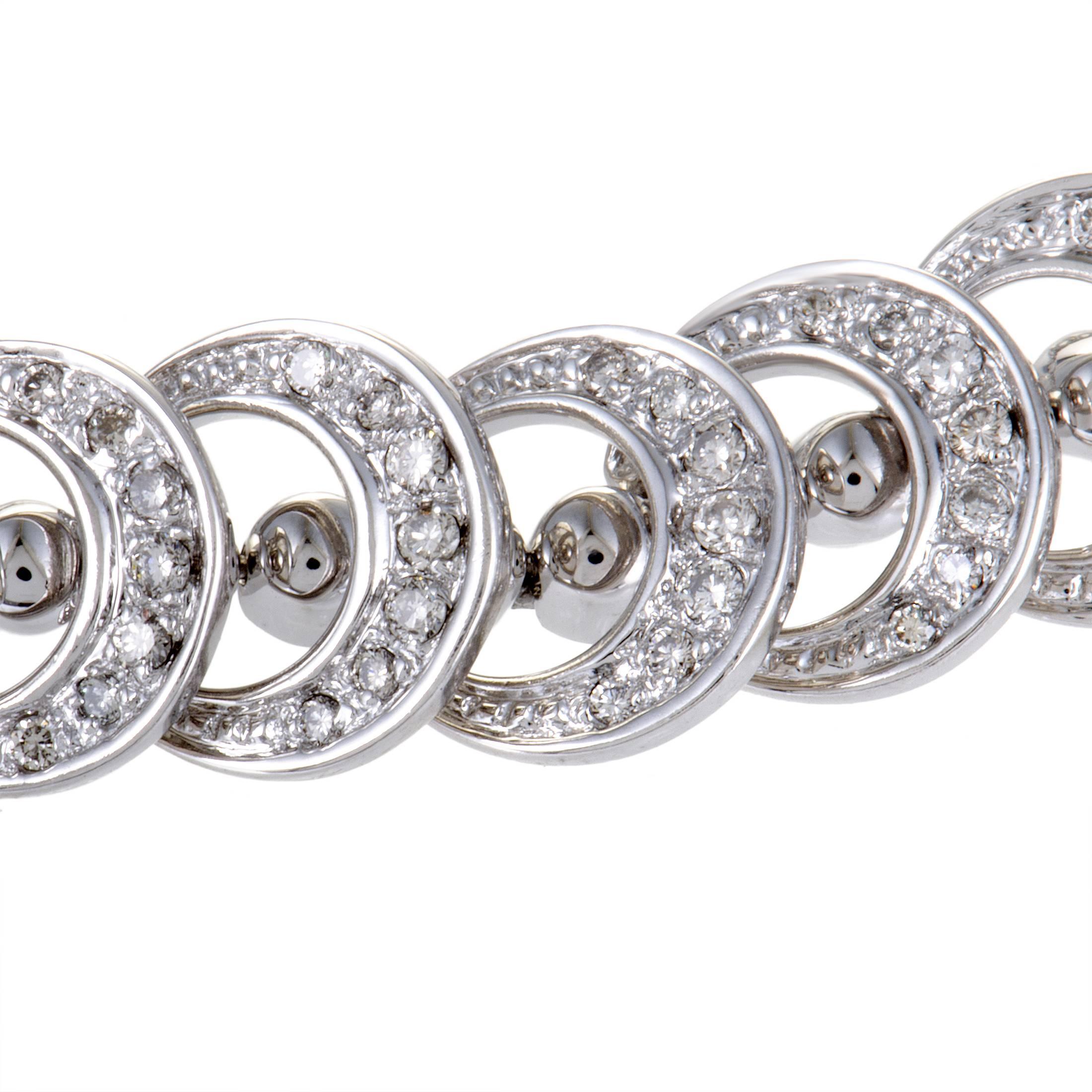An incredibly imaginative design graces this stunning bracelet made of 18K white gold that offers an alluringly prestigious appearance. The bracelet is generously set with resplendent diamond stones that weigh in total 2.00 carats.
