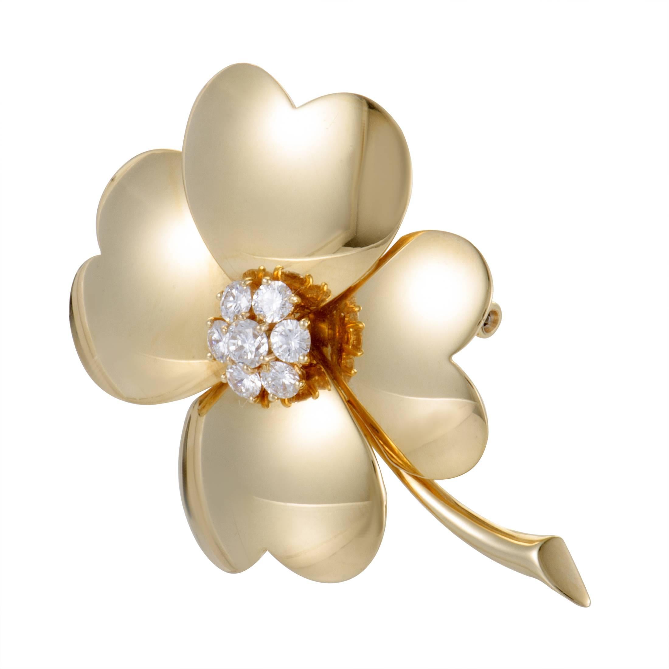 A sublime piece from the ever-enchanting “Cosmos” collection, this exceptional vintage brooch designed by Van Cleef & Arpels exudes charm and elegance. The brooch is made of classy 18K yellow gold and decorated with sparkly diamonds that weigh 1.00