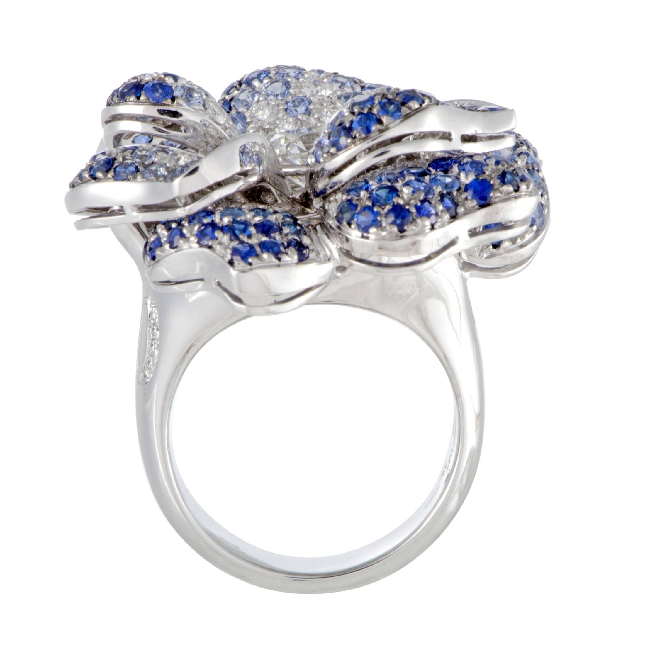 An embodiment of unrestrained splendor and luxurious elegance, this spectacular ring offers an exceptionally eye-catching, extravagant appearance. Designed by Leo Pizzo, the ring is made of 18K white gold and paved with 3.25 carats of sapphires and