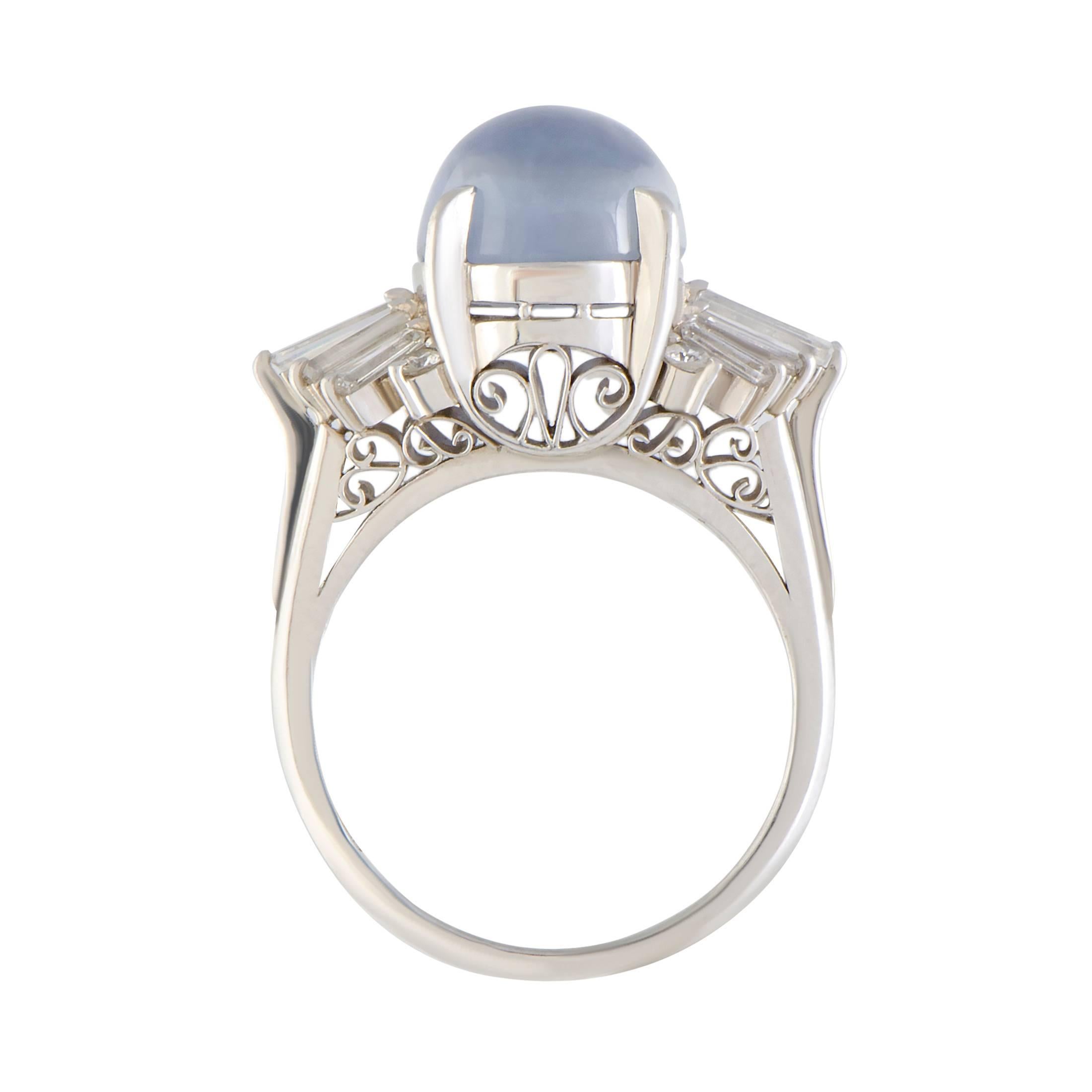 Endearingly feminine and incredibly elegant, this sublime ring enchants with its understated design and tasteful décor. The ring is made of platinum and boasts 0.89 carats of diamonds, while the central spot is reserved for a gorgeous sapphire that